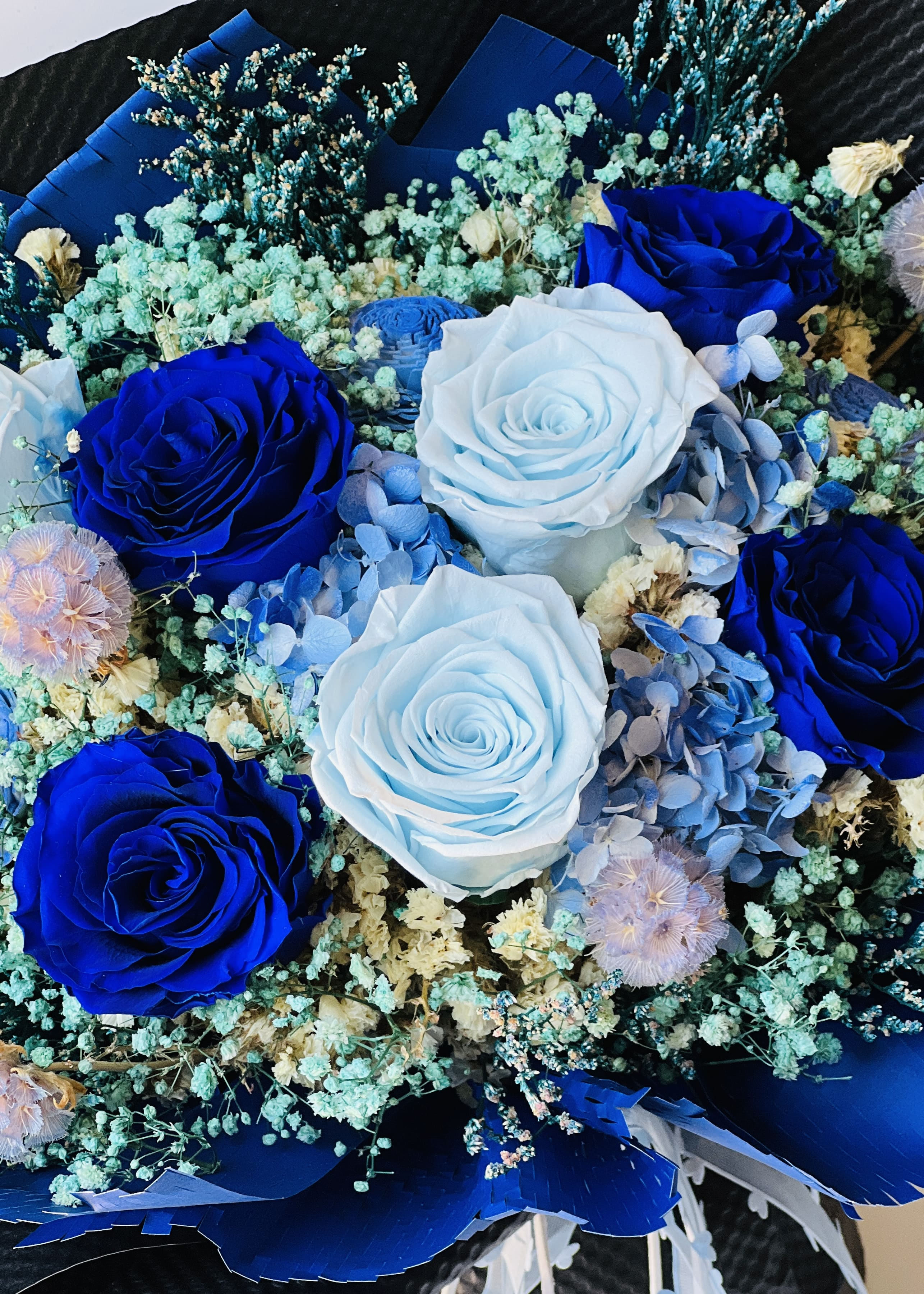 Eternity flower rose bouquet arrangement featuring blue roses, babys breath flower, hydrangea