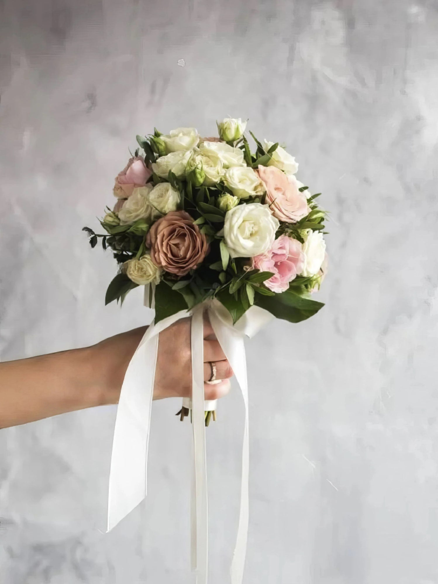 Elegant bridal bouquet with soft pink, white, and beige roses, perfect for weddings and romantic celebrations.