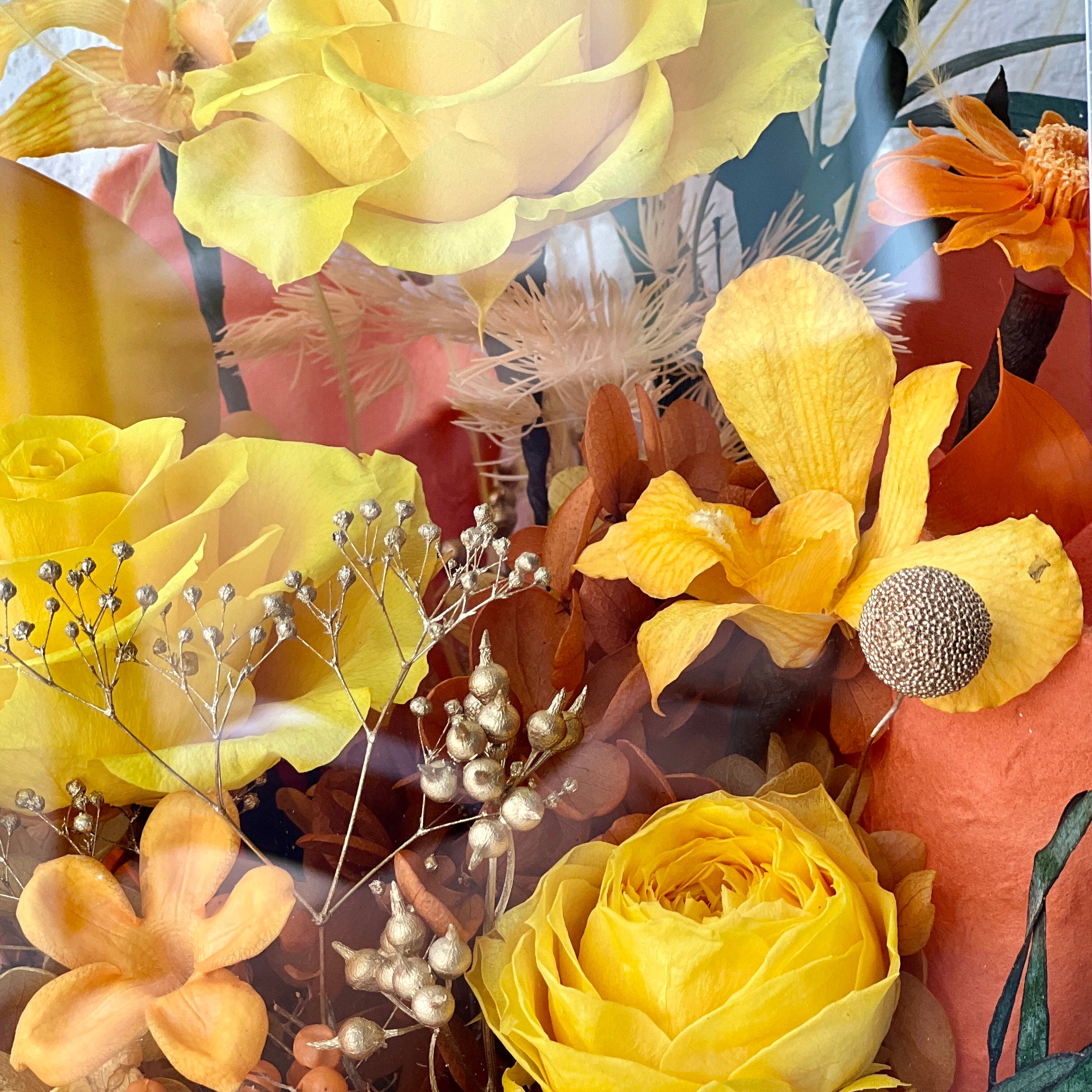 Mini Garden preserved flower arrangement featuring vibrant yellow roses and delicate clematis, elegantly displayed in a sleek acrylic box. A perfect eternity rose gift for bringing warmth and joy to any space.