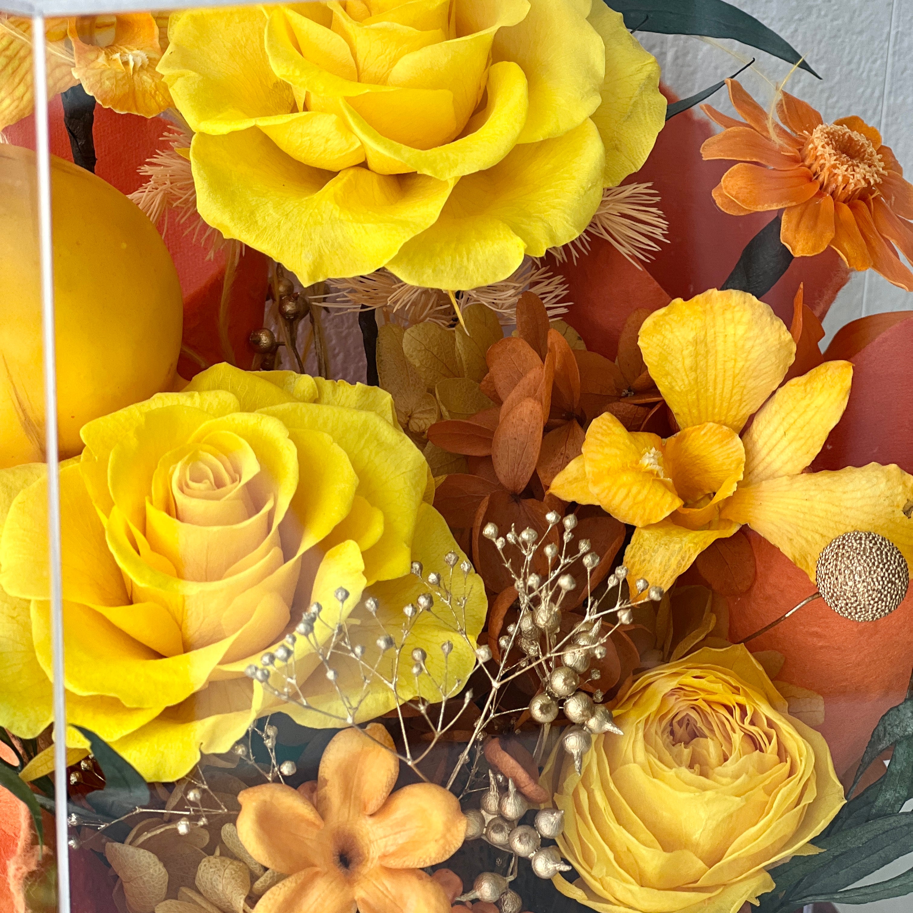 Mini Garden preserved flower arrangement featuring vibrant yellow roses and delicate clematis, elegantly displayed in a sleek acrylic box. A perfect eternity rose gift for bringing warmth and joy to any space.