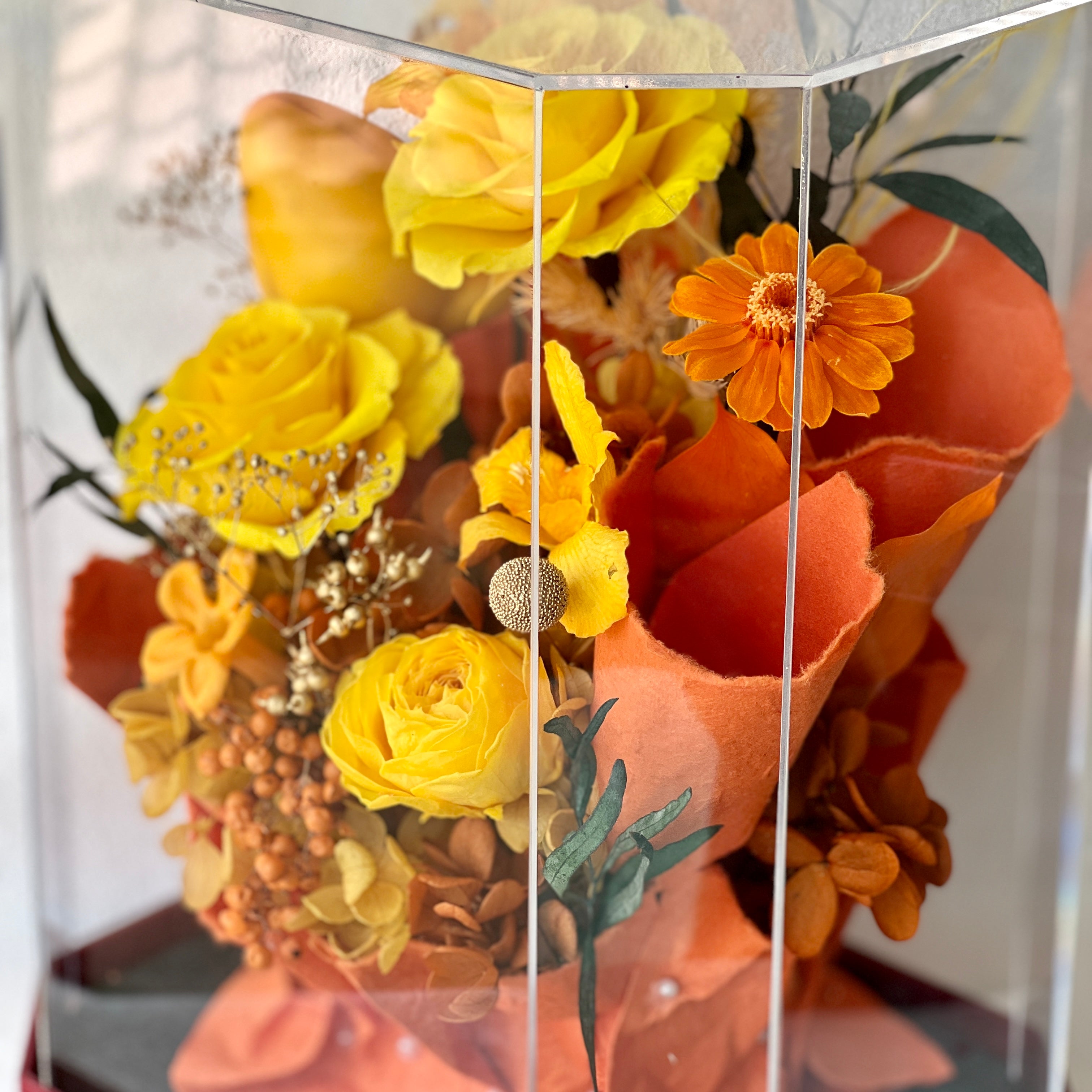 Mini Garden preserved flower arrangement featuring vibrant yellow roses and delicate clematis, elegantly displayed in a sleek acrylic box. A perfect eternity rose gift for bringing warmth and joy to any space.