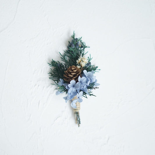 Boutonniere In Pastel Blue With Pine Cone