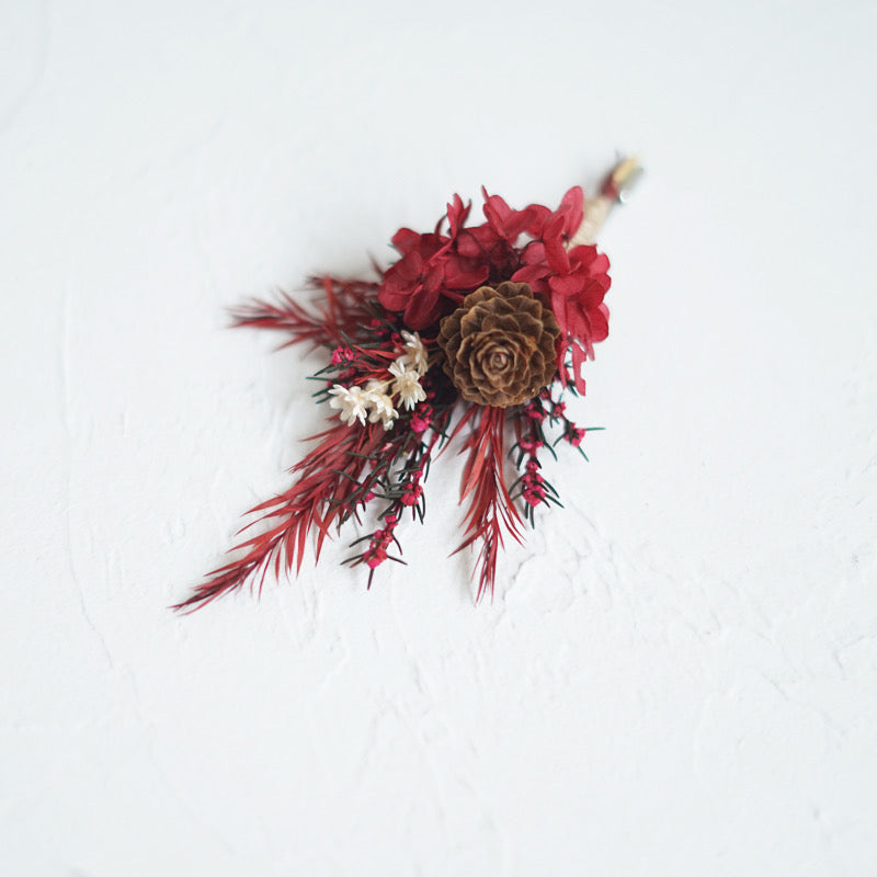 Boutonniere In Crimson Red With Pine Cone