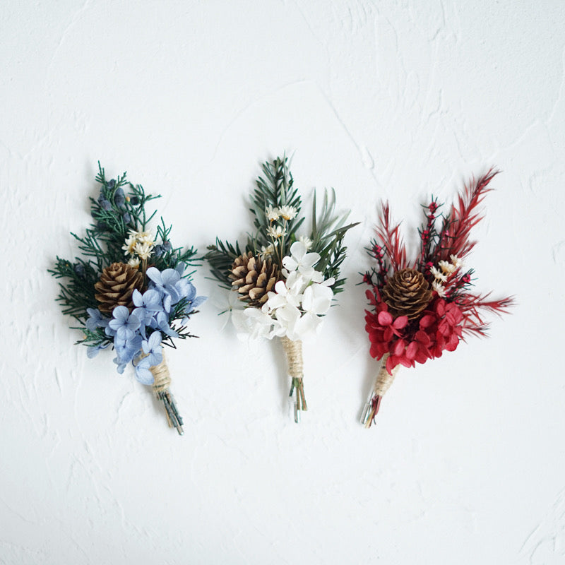 Boutonniere In Pastel Blue With Pine Cone