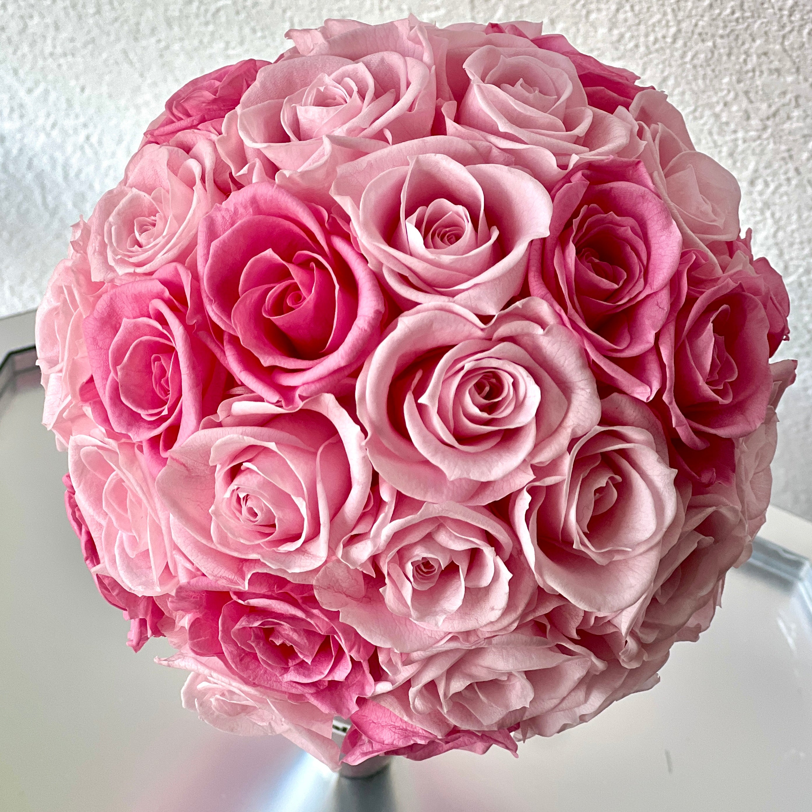 The Preserved Pink Rose Ice Cream Cone features vibrant pink roses arranged like a scoop of strawberry ice cream. A whimsical eternity rose gift perfect for bringing joy to any space or occasion.