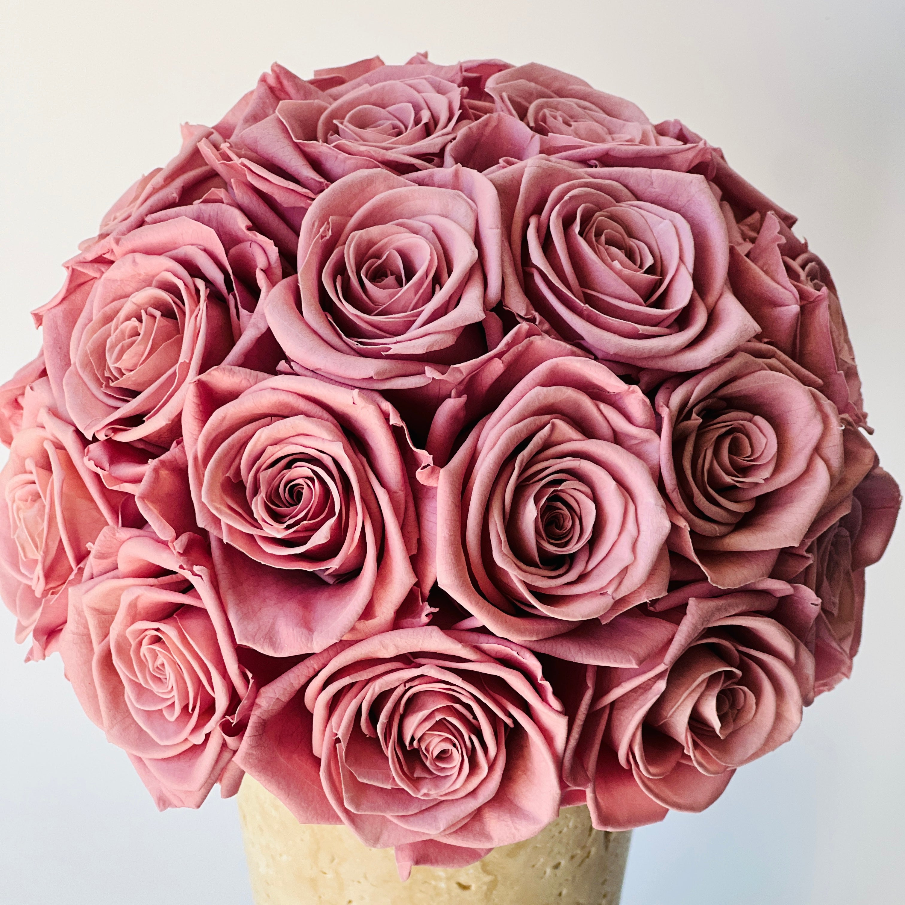 Flower vase arrangement made of dusty pink eternity rose flower