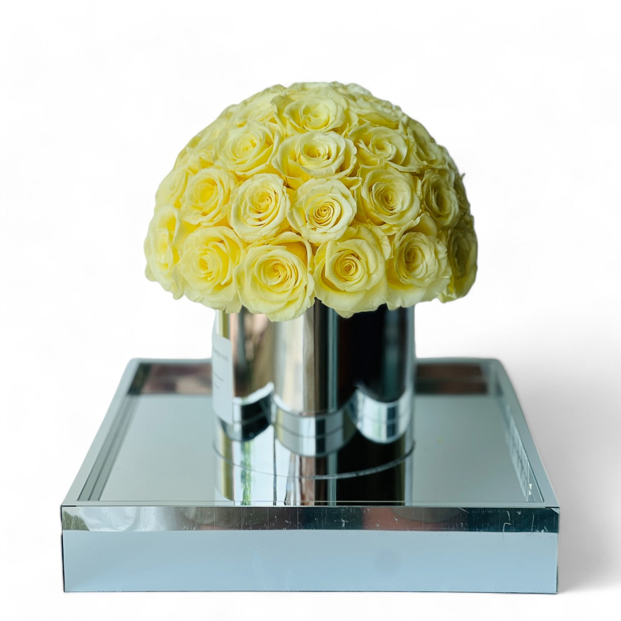 The Preserved Yellow Rose Arrangement showcases expertly preserved roses with a soft, vibrant hot pink hue and petal-perfect texture. This timeless eternity rose gift adds everlasting elegance to any space, making it perfect for special occasions like Valentine's Day or anniversaries.