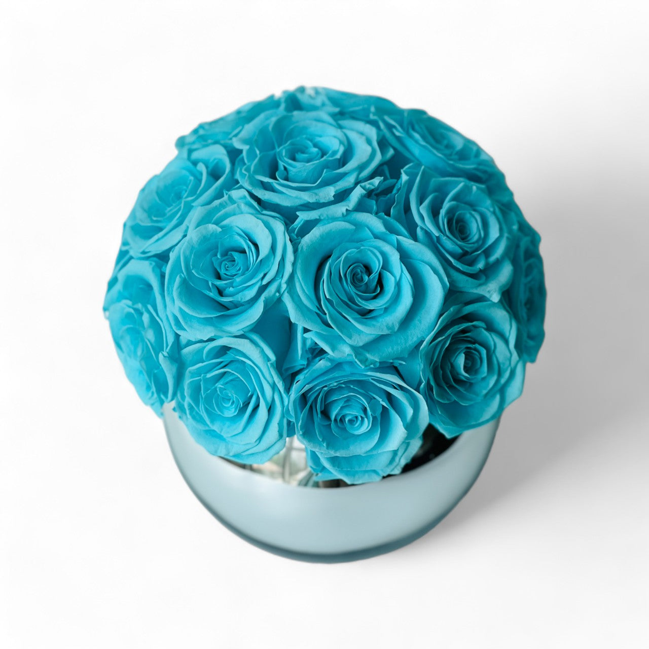 Tiffany Blue Rose Hatbox: Preserved blue roses on a sleek grey base inscribed with love is eternal. Elegant, tranquil, and perfect for any special occasion.