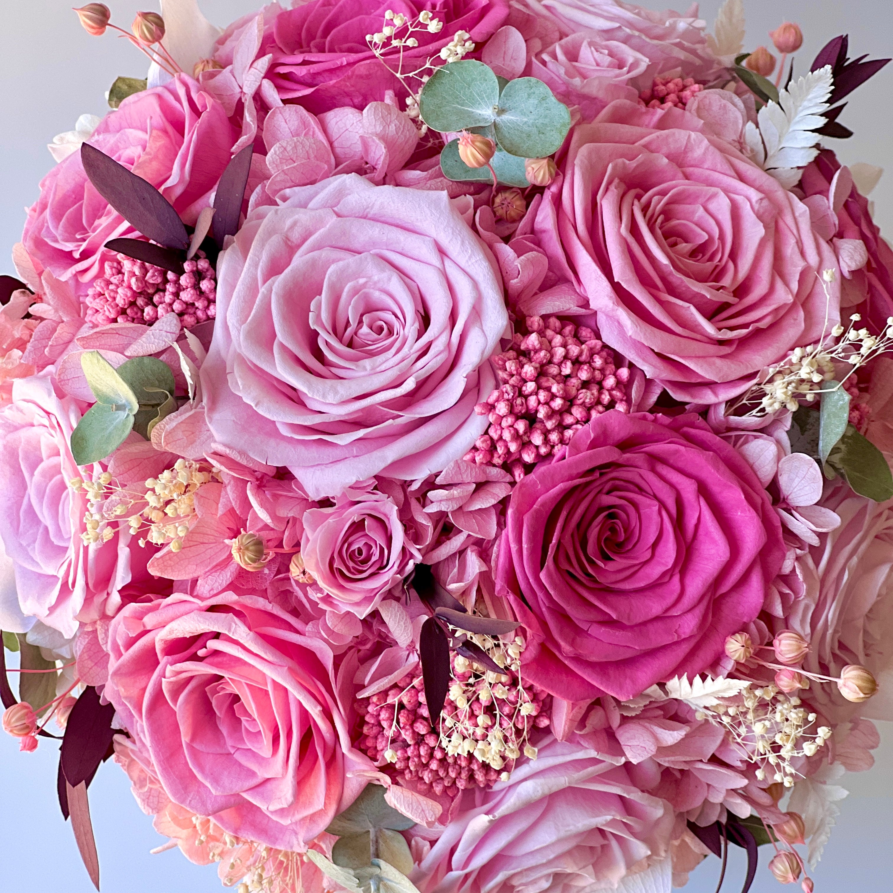 Radiant Rosé Bouquet featuring preserved pink roses, hydrangeas, and baby's breath, accented with greenery in a modern vase. Adds timeless charm and luxury to any space, maintenance-free for lasting beauty. Perfect as a thoughtful gift or elegant decor piece.