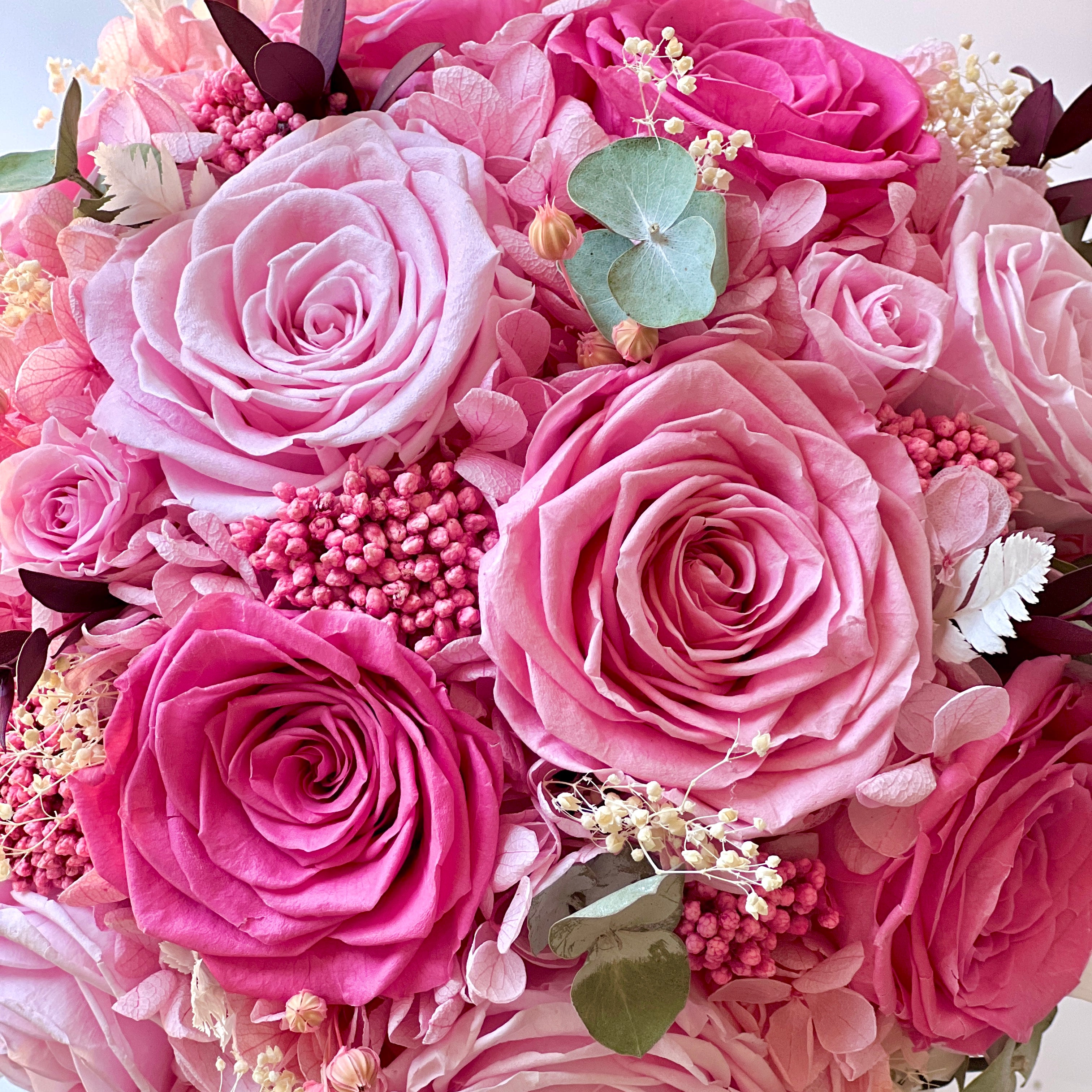 Radiant Rosé Bouquet featuring preserved pink roses, hydrangeas, and baby's breath, accented with greenery in a modern vase. Adds timeless charm and luxury to any space, maintenance-free for lasting beauty. Perfect as a thoughtful gift or elegant decor piece.