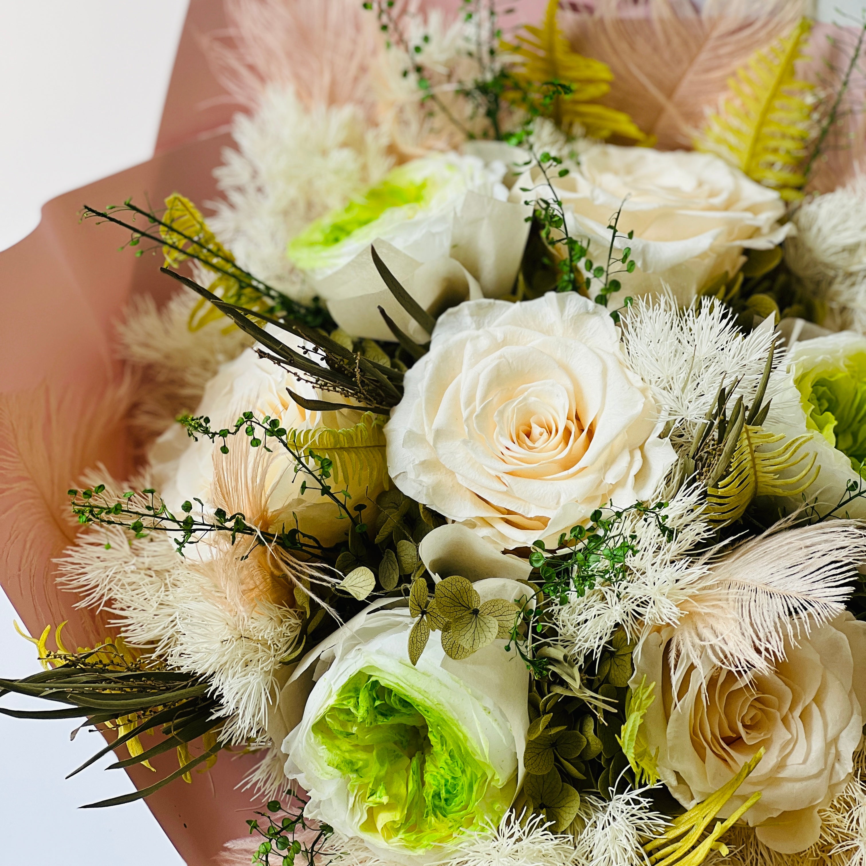 Radiant Rosé Bouquet featuring preserved pink roses with delicate greenery in a sleek vase. Adds timeless charm and luxury to any space, maintenance-free for lasting beauty. Ideal for gifts or elegant decor.