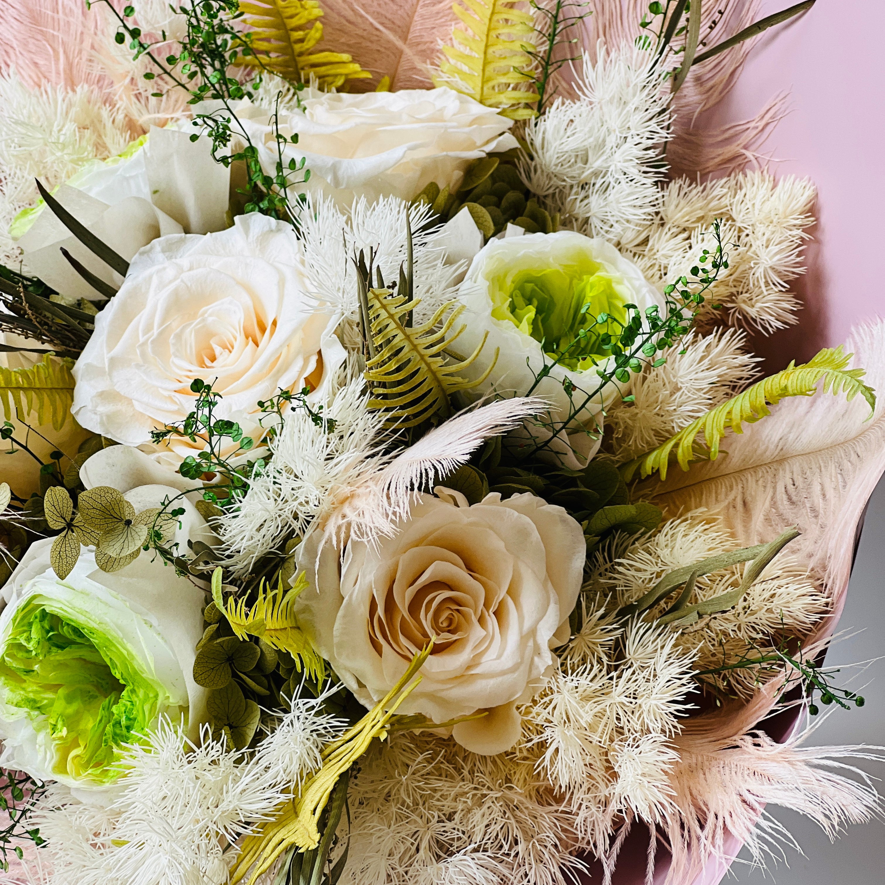 Radiant Rosé Bouquet featuring preserved pink roses with delicate greenery in a sleek vase. Adds timeless charm and luxury to any space, maintenance-free for lasting beauty. Ideal for gifts or elegant decor.