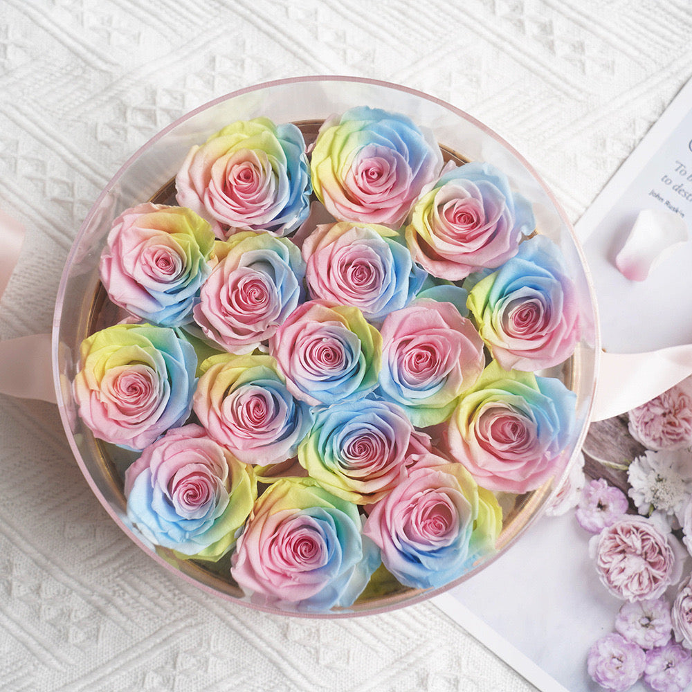 Stunning floral box featuring 16 long-stemmed preserved roses, available in multiple colors, elegantly arranged in a round box. A perfect eternity rose gift for birthdays, anniversaries, or Valentine's Day.