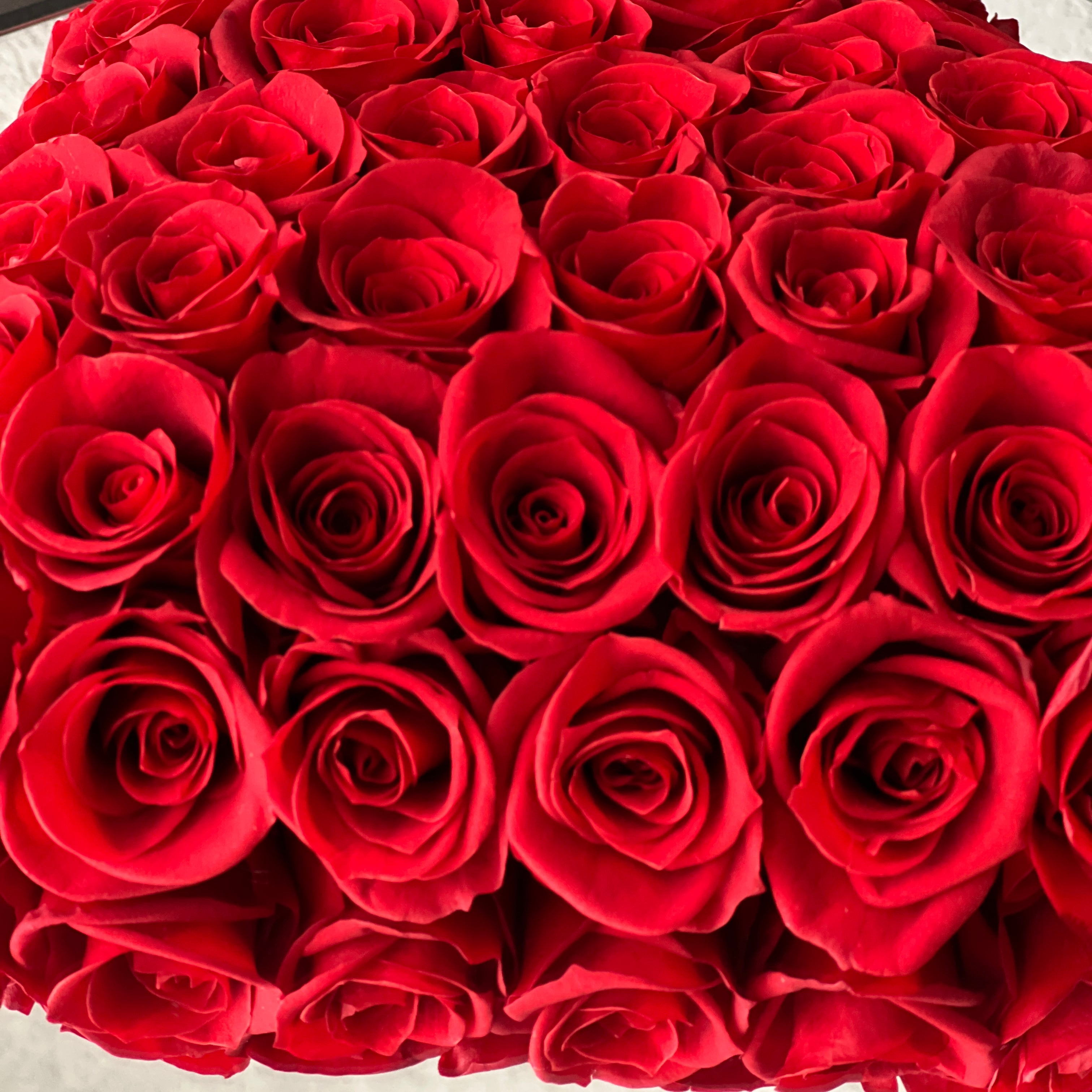 The Heart Felt Rose Box features around 6 dozen preserved roses arranged in a heart design, offering a romantic and elegant gesture. Perfect as an eternity rose gift for special occasions like Valentine's Day or anniversaries.