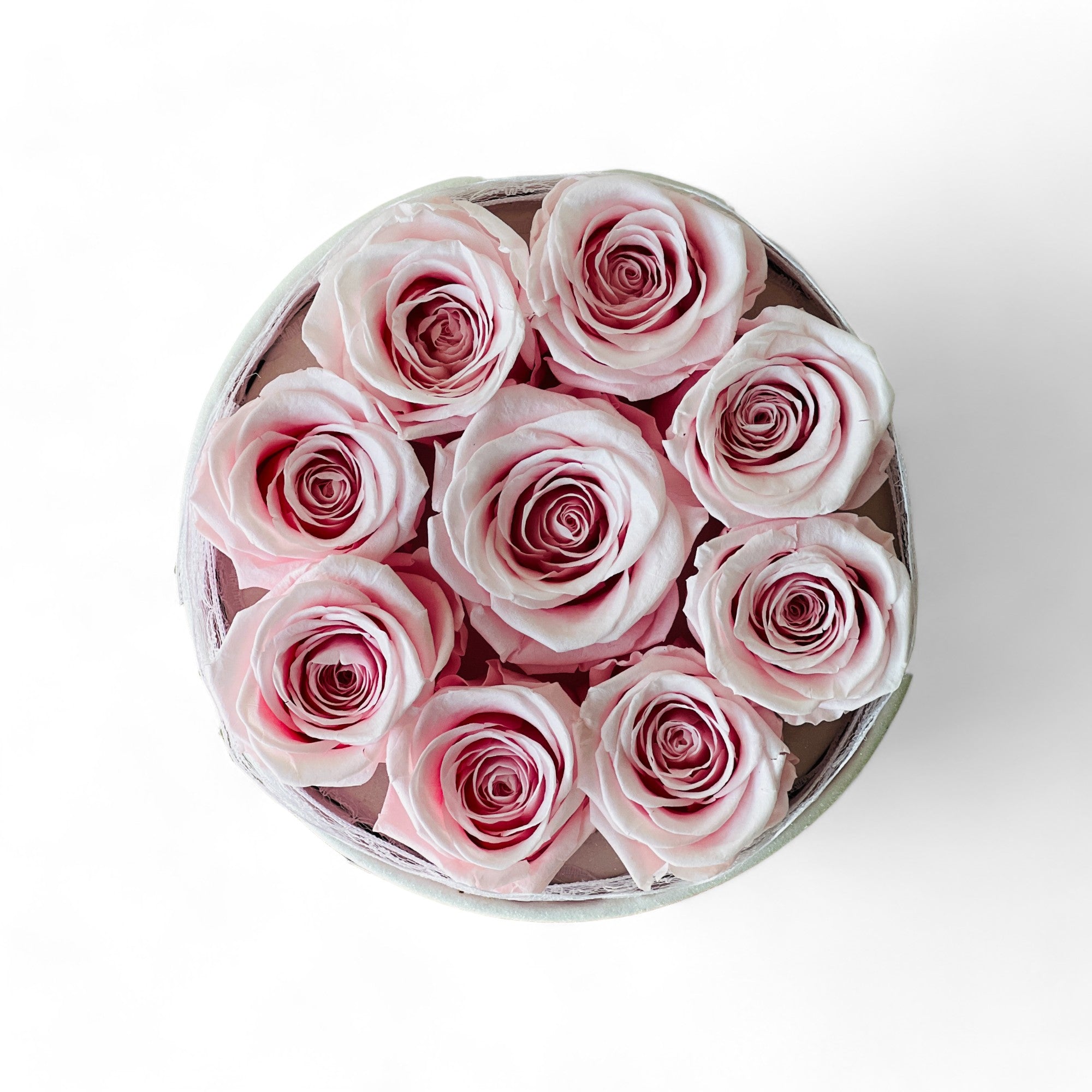 Signature Rose Basket arrangement featuring 9 preserved pink roses in a classic acrylic box with glass bottom. A luxurious eternity rose gift ideal for special occasions like Valentine's Day or anniversaries.