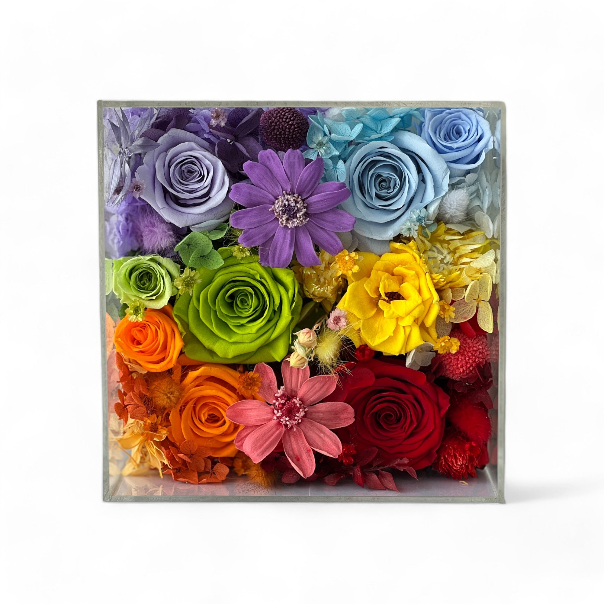 The Rainbow Floral Box features preserved roses, clematis, and hydrangeas in a vibrant, multicolor arrangement. A stunning eternity flower gift perfect for bringing romance to life on any special occasion.