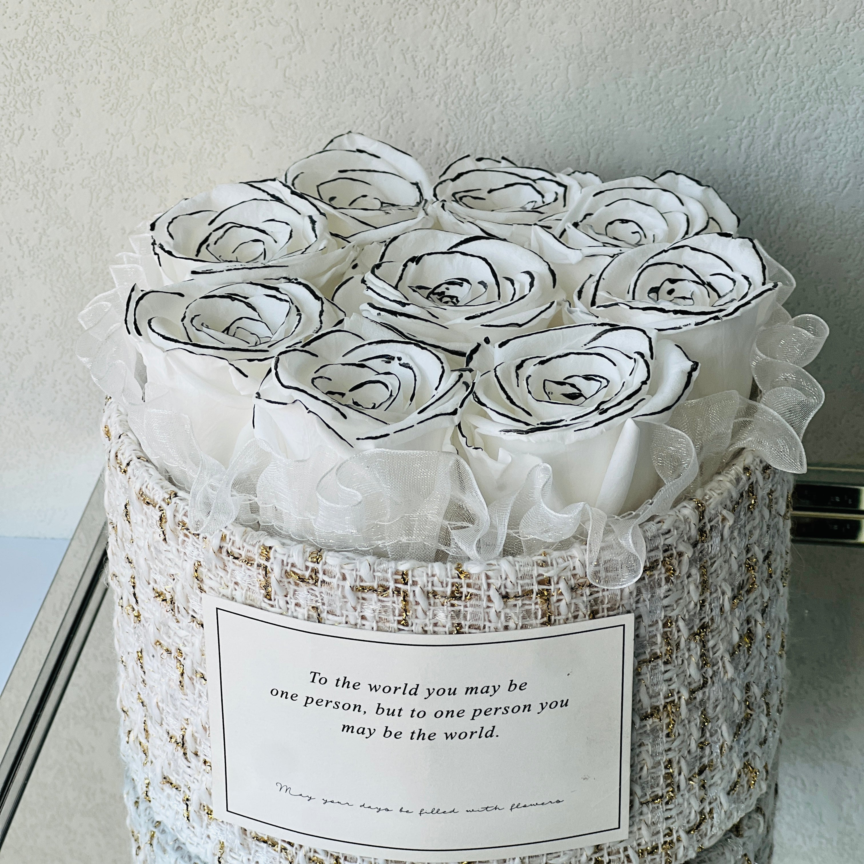 Signature Rose Basket featuring 12 preserved white roses elegantly arranged in a classic woven basket. A luxurious eternity rose gift perfect for adding grace to any space or gifting on special occasions.