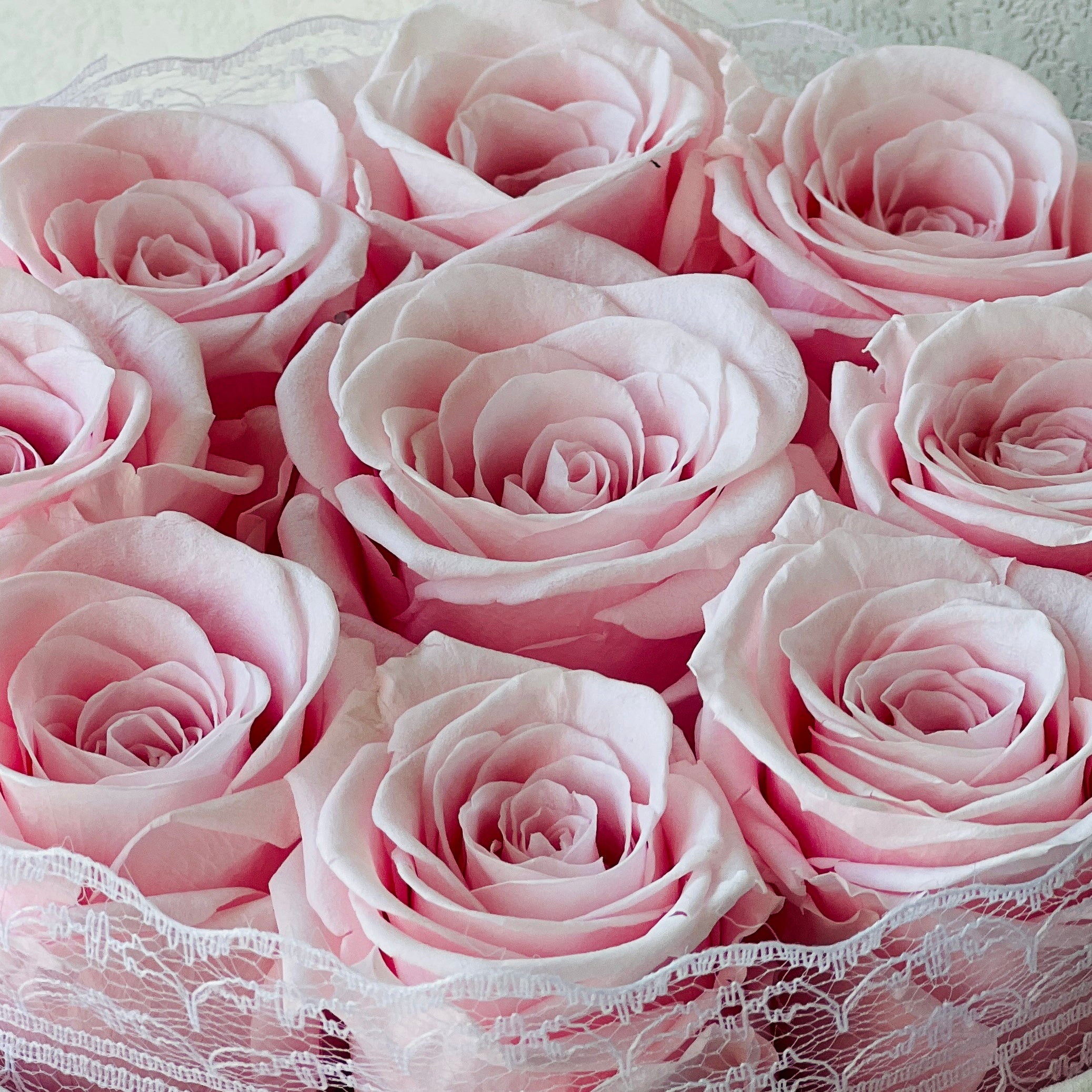 Signature Rose Basket arrangement featuring 9 preserved pink roses in a classic acrylic box with glass bottom. A luxurious eternity rose gift ideal for special occasions like Valentine's Day or anniversaries.