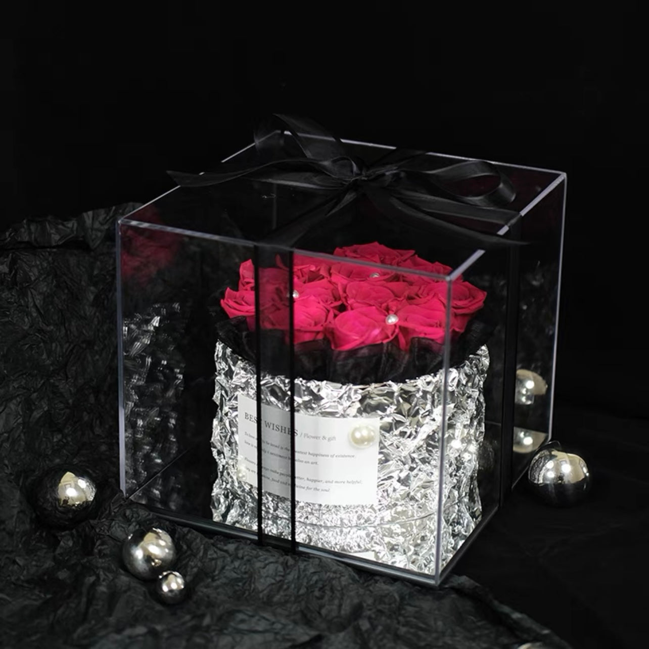 Romantic floral arrangement featuring vibrant preserved hot pink roses, perfect for surprising your sweetheart with a gesture of love. An exquisite eternity rose gift for special occasions like Valentine's Day or anniversaries.