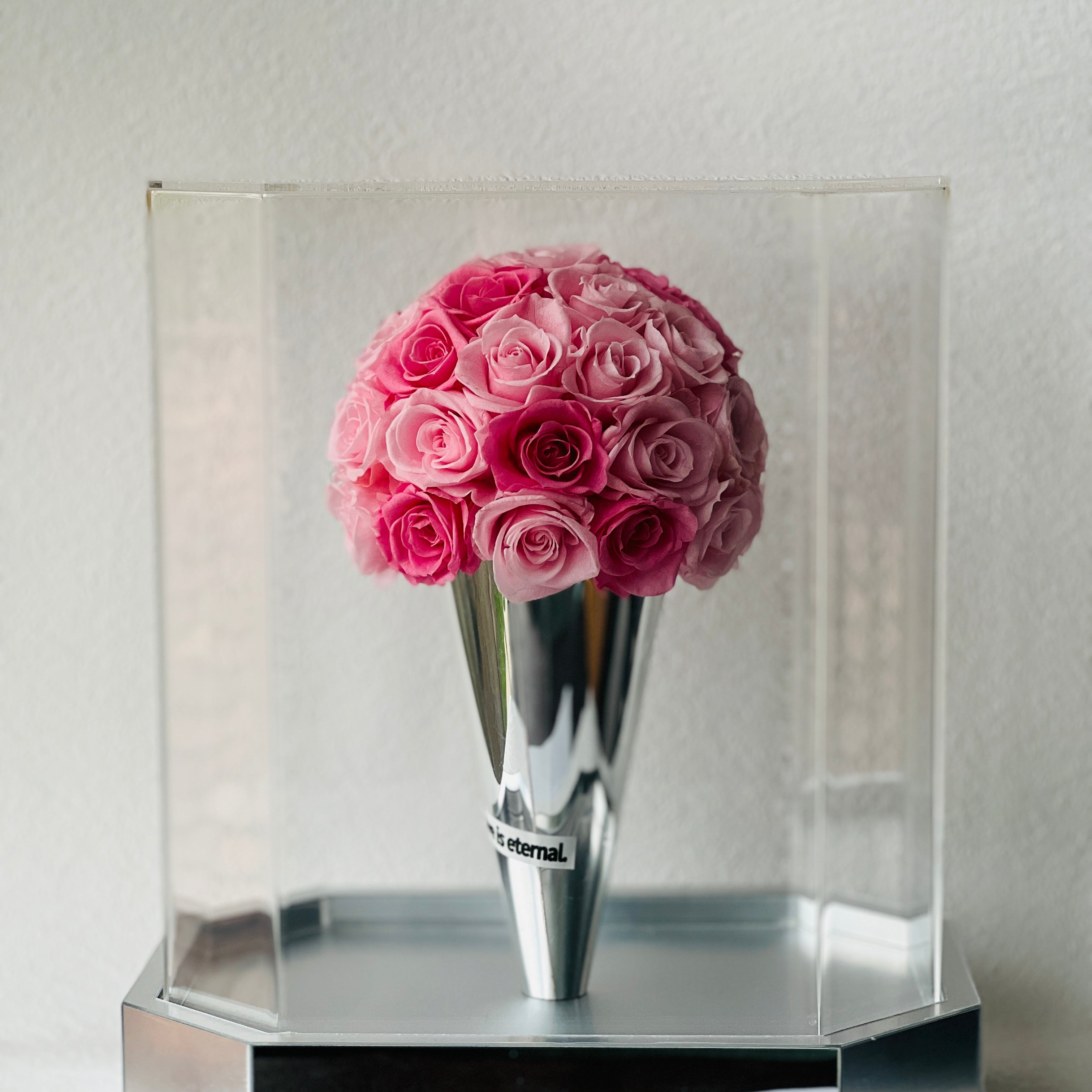 The Preserved Pink Rose Ice Cream Cone features vibrant pink roses arranged like a scoop of strawberry ice cream. A whimsical eternity rose gift perfect for bringing joy to any space or occasion.