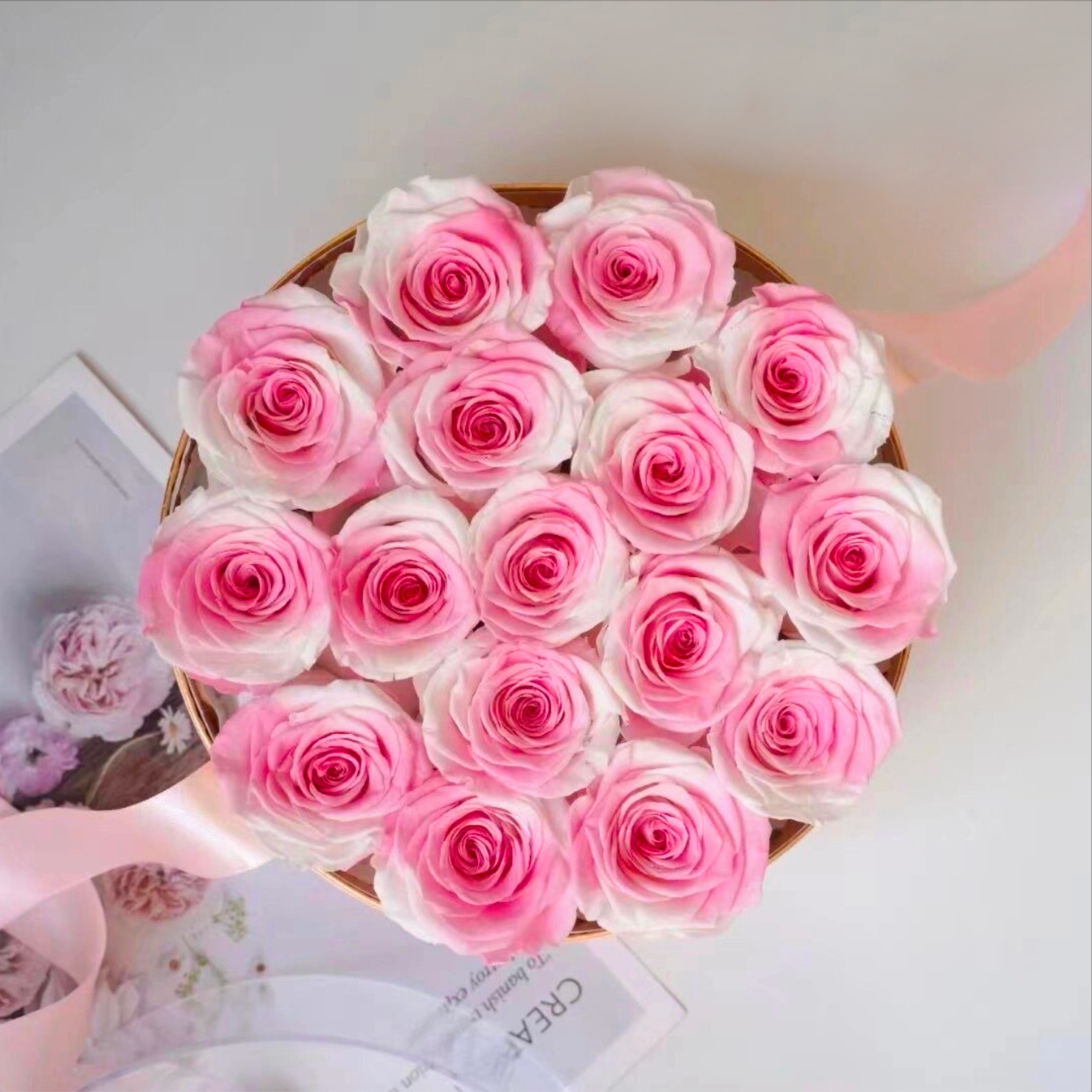 Stunning floral box featuring 16 long-stemmed preserved roses, available in multiple colors, elegantly arranged in a round box. A perfect eternity rose gift for birthdays, anniversaries, or Valentine's Day.