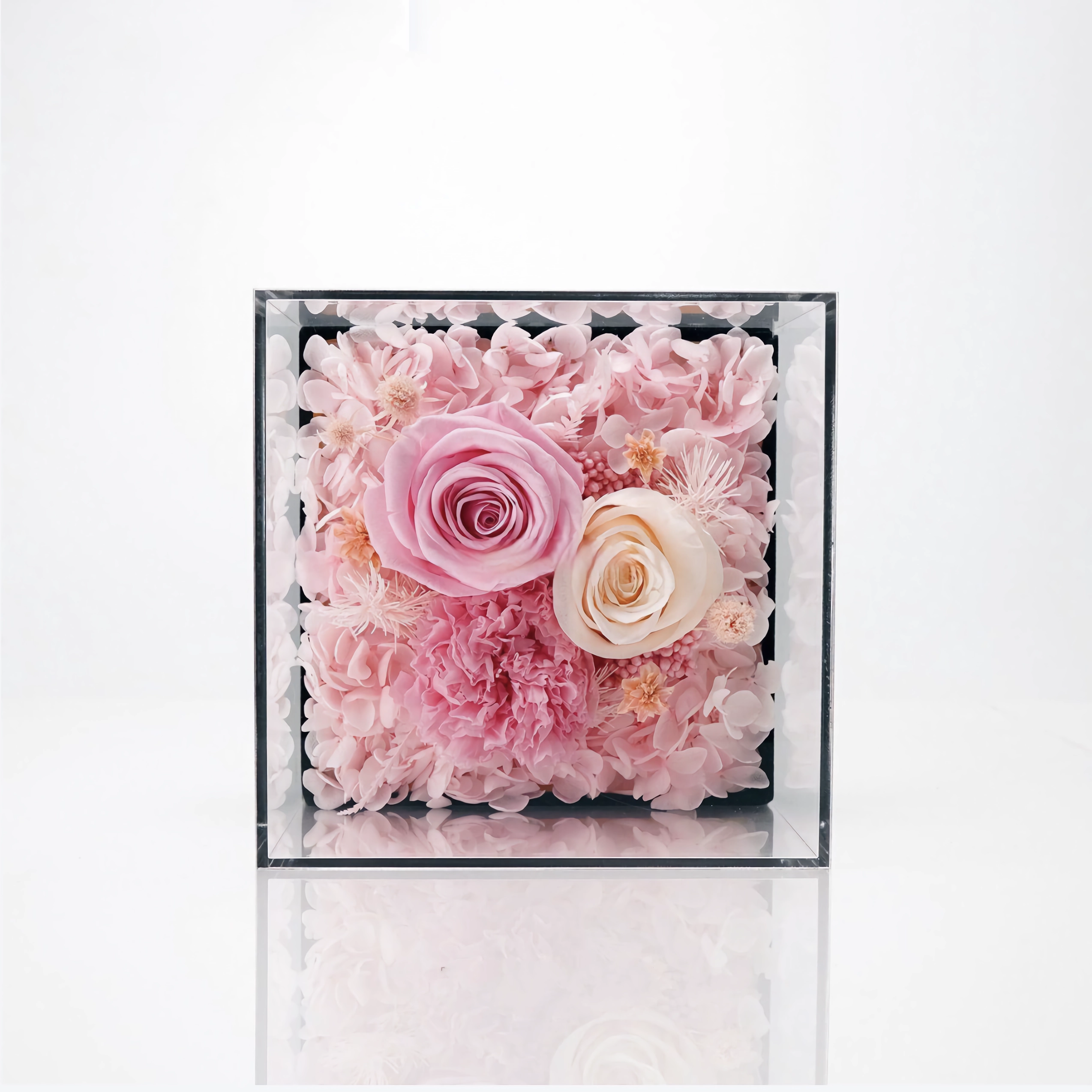 The 2 Rose Mini Floral Box features two preserved roses elegantly arranged in a compact box. A charming and petite eternity rose gift perfect for brightening any special occasion.