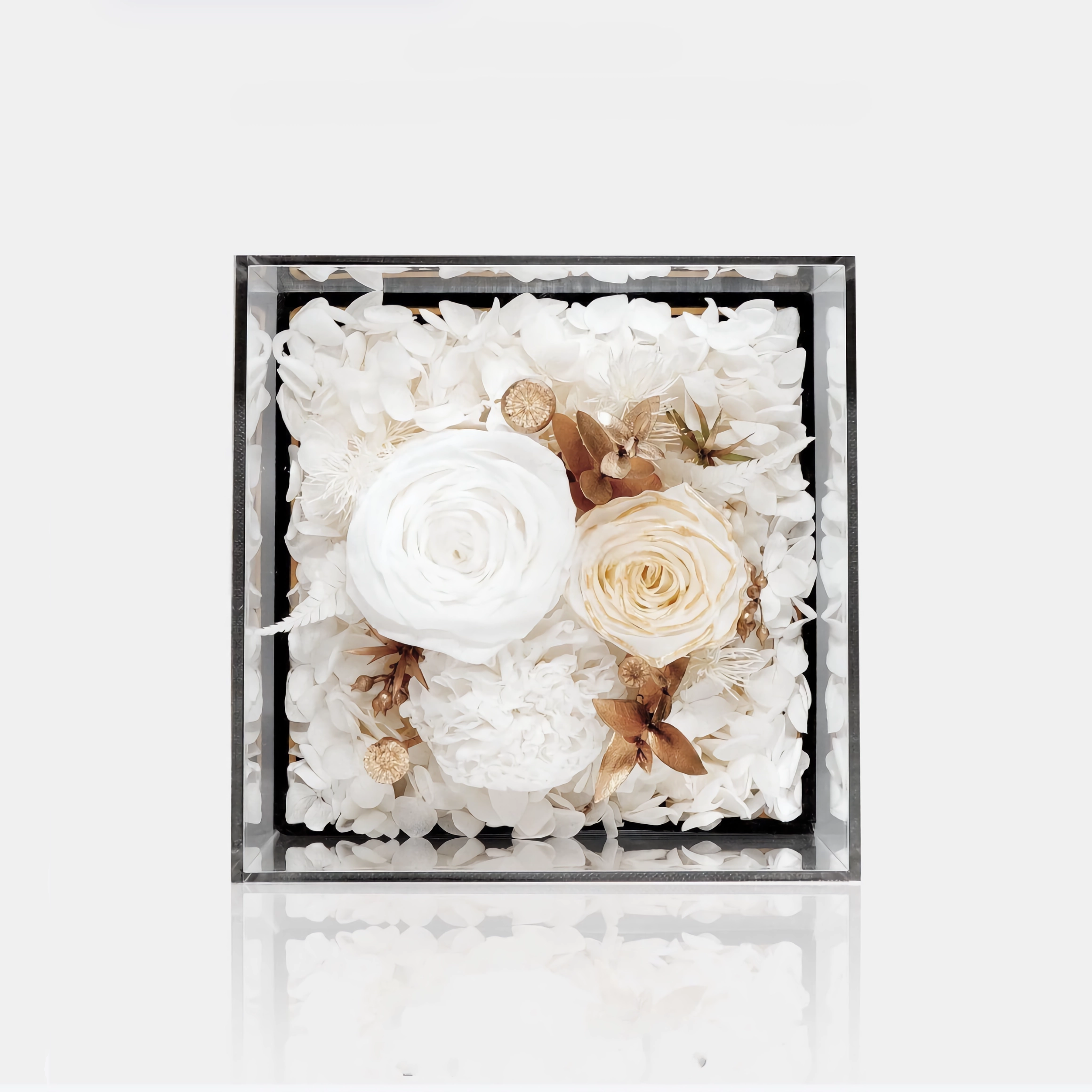 The Mini Floral Box features three preserved roses and carnelian elegantly arranged in a compact design. A charming eternity rose gift perfect for making a heartfelt impact on any special occasion.