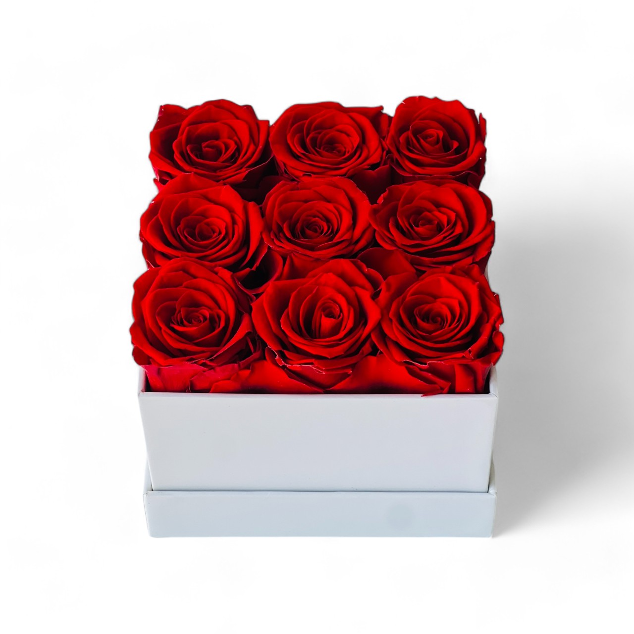 Signature Rose Floral Box featuring 9 preserved red roses arranged in a classic white hatbox. This luxurious eternity rose gift is perfect for adding elegance to any space or gifting on special occasions like Valentine's Day or anniversaries.