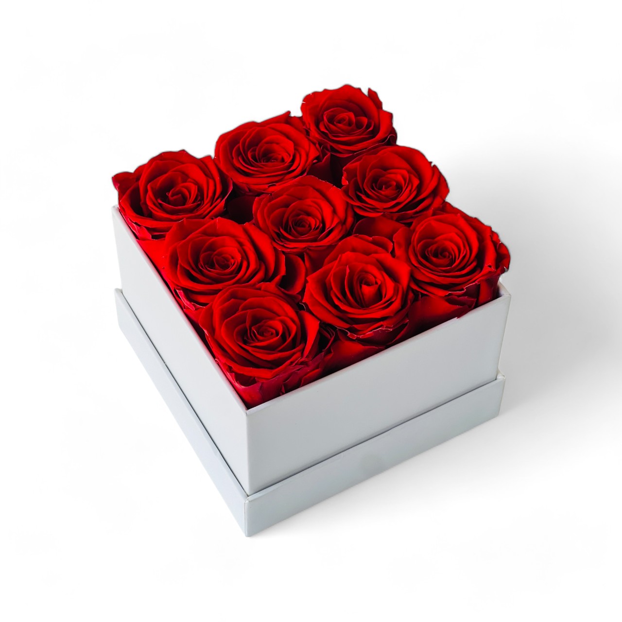 Signature Rose Floral Box featuring 10 preserved red roses arranged in a classic white hatbox. This luxurious eternity rose gift is perfect for adding elegance to any space or gifting on special occasions like Valentine's Day or anniversaries.