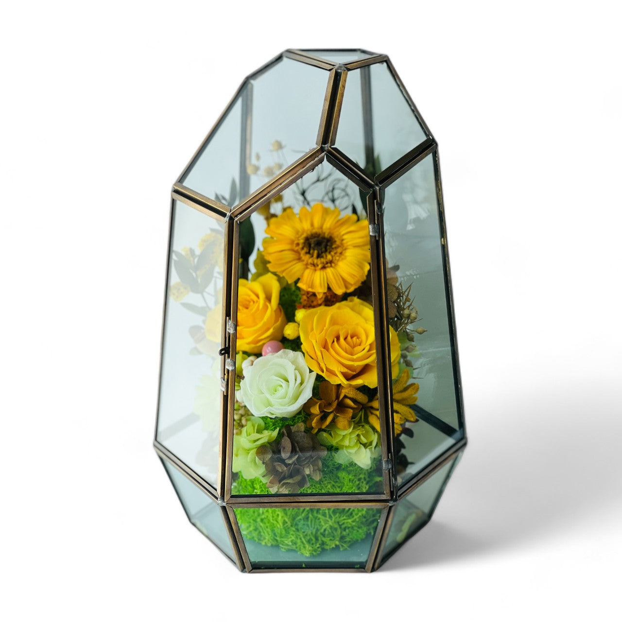 Sunshine and Serenity preserved floral arrangement featuring sunny yellow roses, a cheerful sunflower, and delicate white roses in a geometric acrylic terrarium. A perfect eternity rose gift to brighten any space.