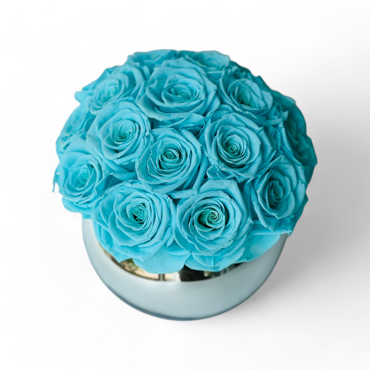 Preserved Tiffany Blue Rose Arrangement: Timeless beauty in soft blue hues. Expertly preserved blooms offer elegance without maintenance, perfect for any space or gift.