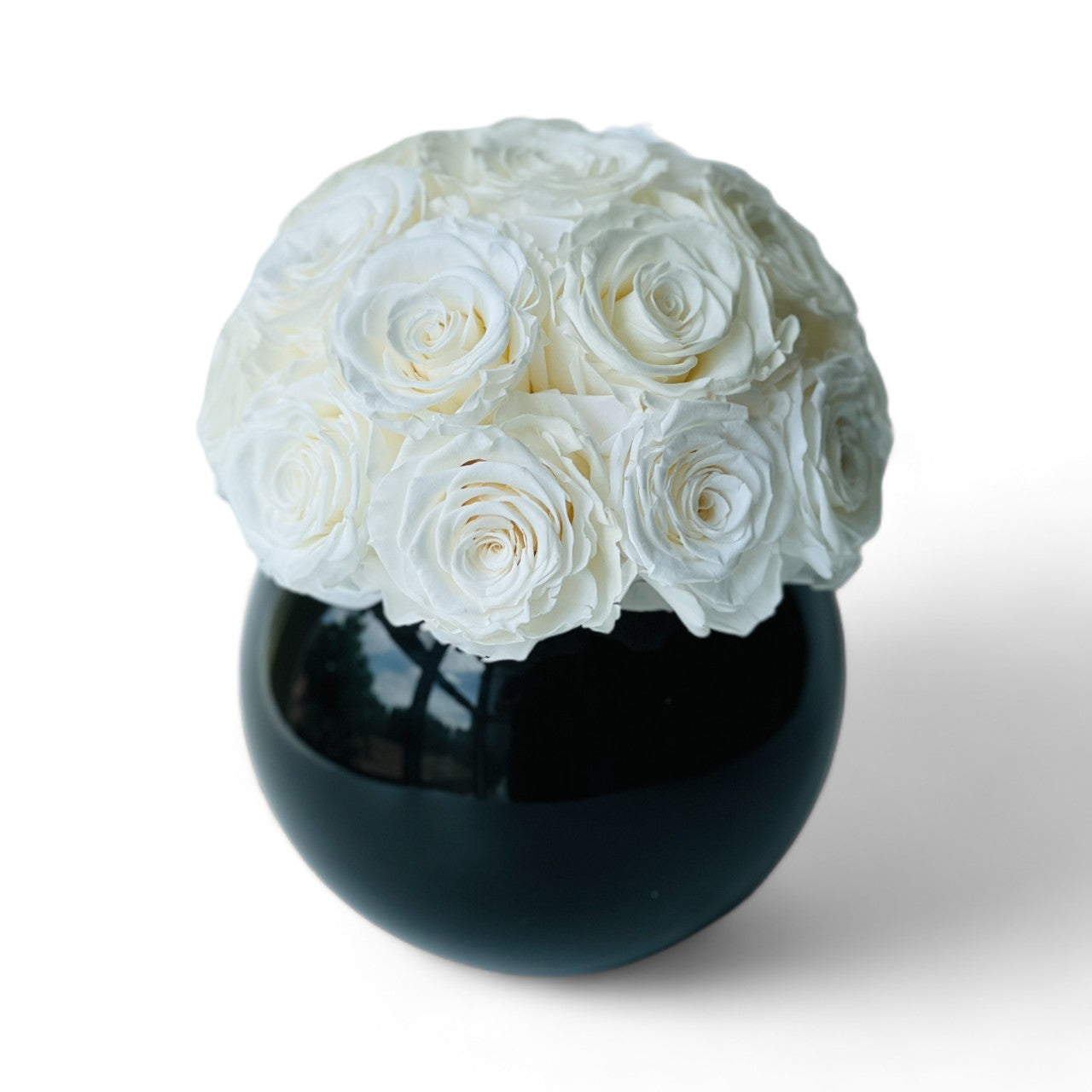 Ecuadorian White Roses in Black Vase: A striking sphere of preserved roses in a glossy vase, perfect for adding a touch of elegance to any space—no maintenance required.