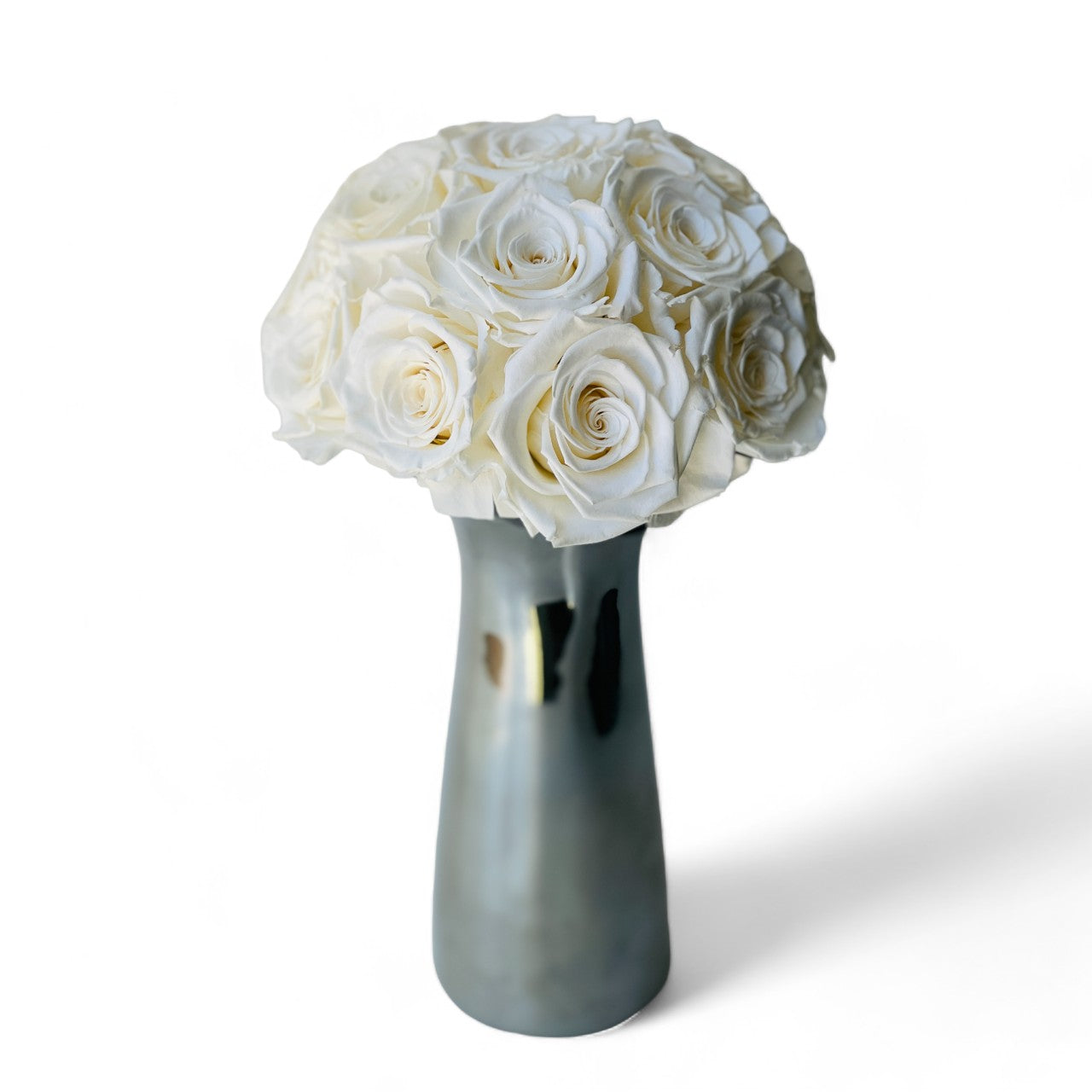 White Preserved Rose Bouquet: Sixteen preserved white roses in a modern vase, offering lasting beauty without maintenance—ideal for home decor or gifting.