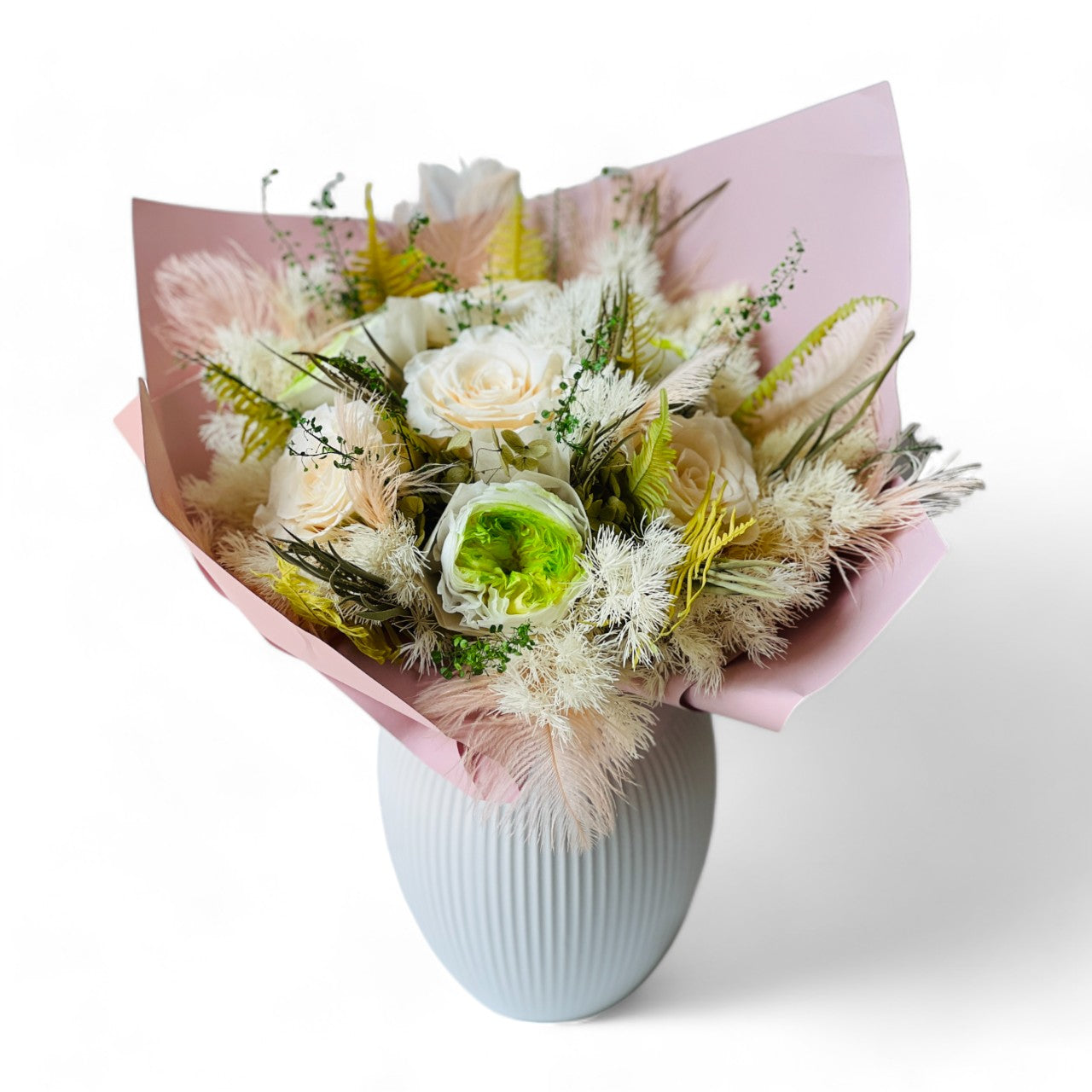 Radiant Rosé Bouquet featuring preserved pink roses with delicate greenery in a sleek vase. Adds timeless charm and luxury to any space, maintenance-free for lasting beauty. Ideal for gifts or elegant decor.