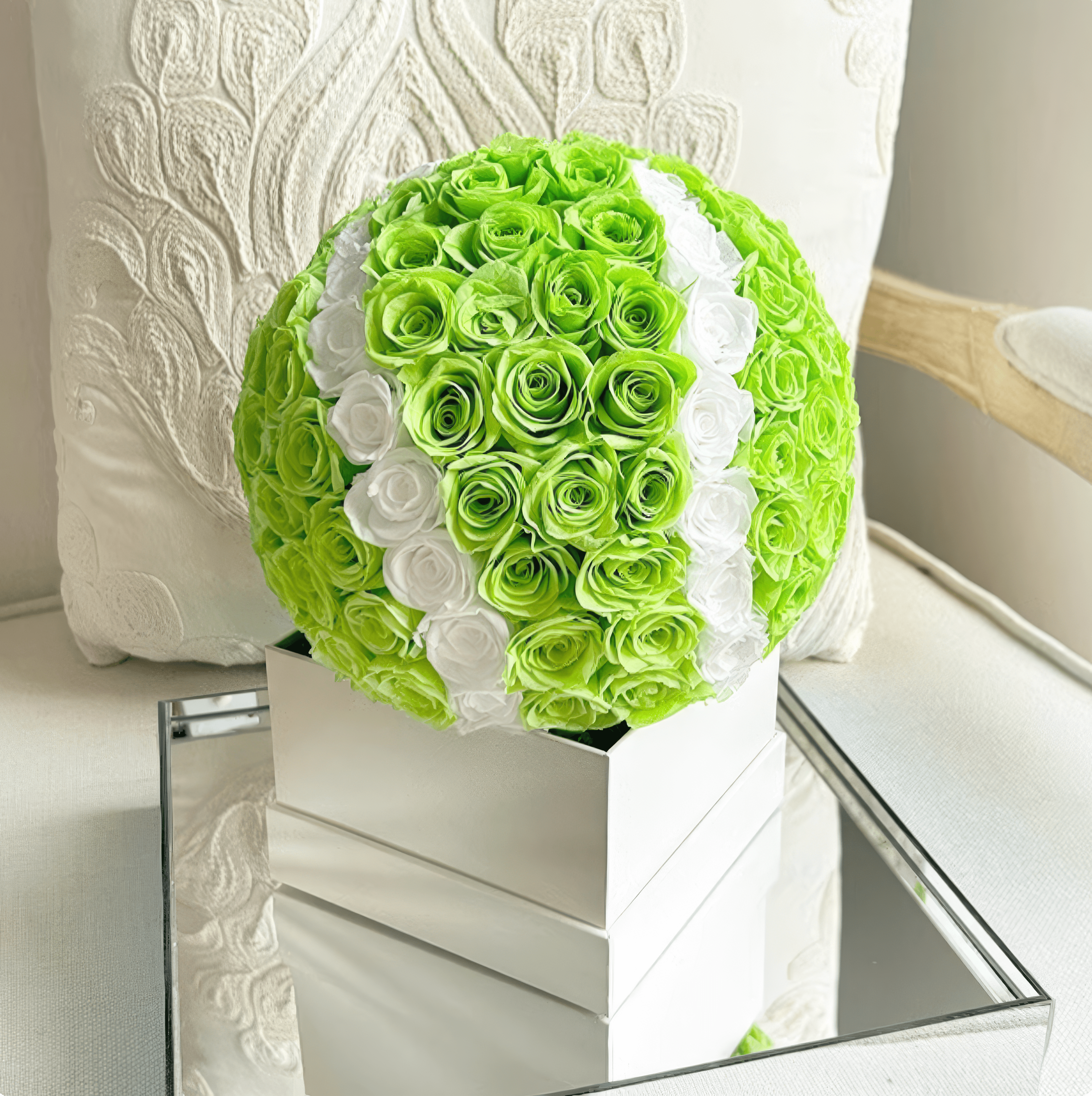 Tennis ball design floral arrangement with preserved green and white eternity roses, perfect for creative home or event decoration.