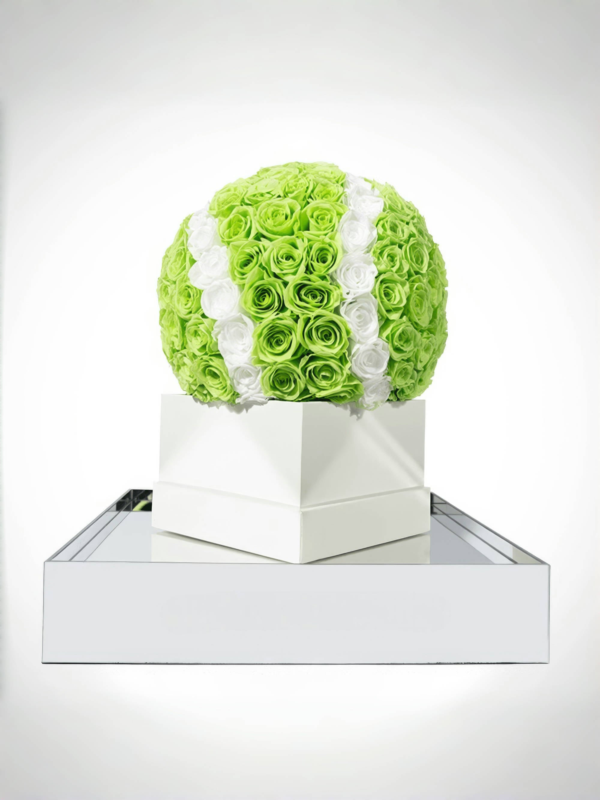 Unique tennis ball-inspired preserved eternity rose arrangement in green and white, ideal for sports-themed decor or special events.