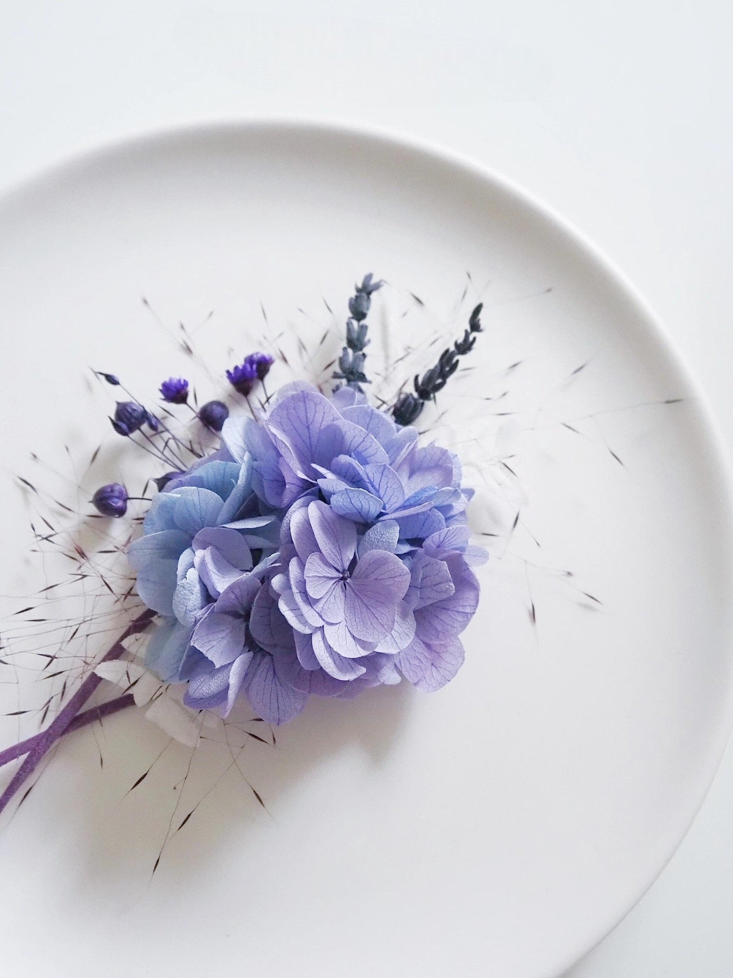 Close-up of lavender hydrangea floral accessories for weddings.
