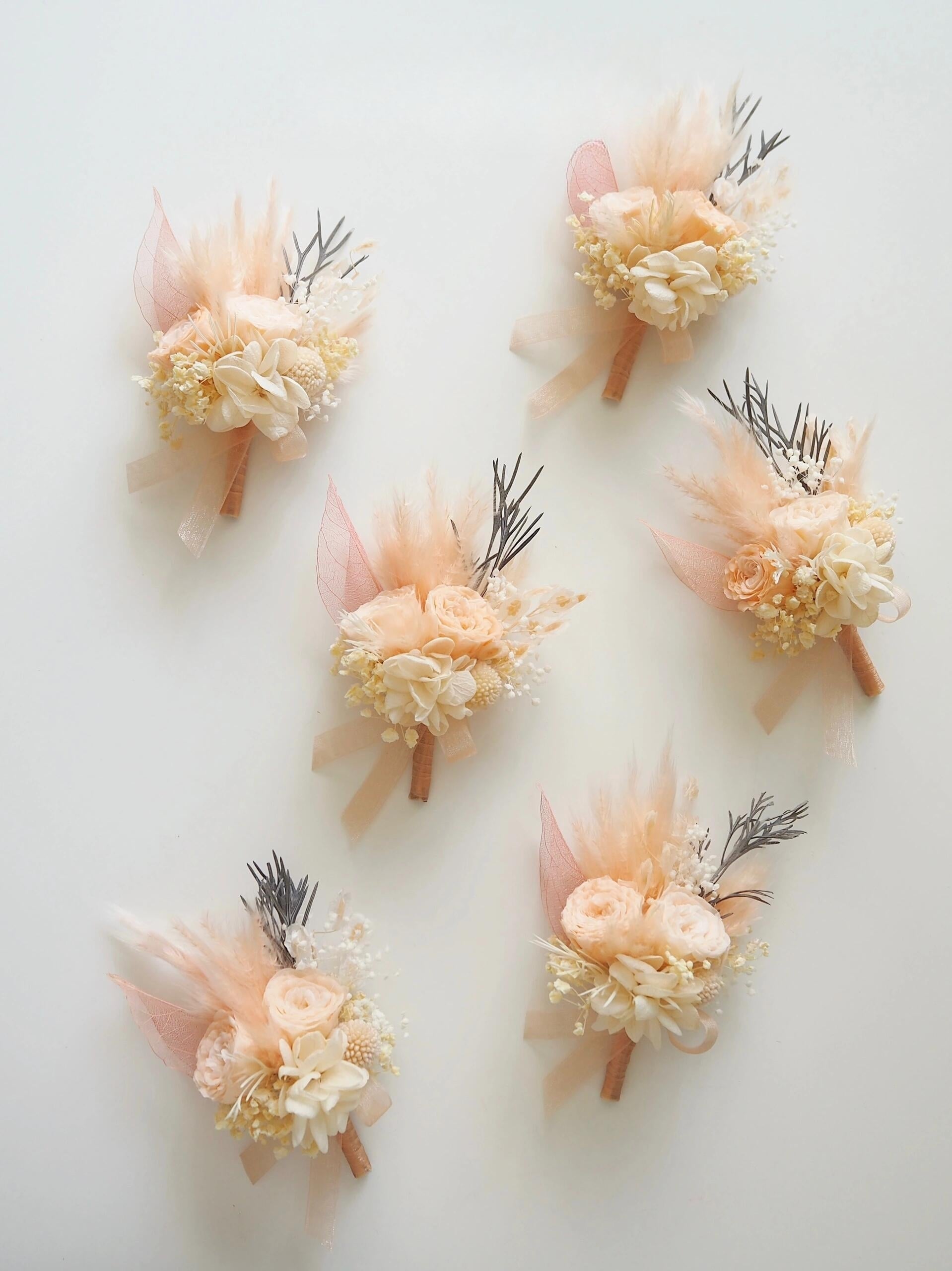 Peach ranunculus and pampas grass preserved flower boutonniere
