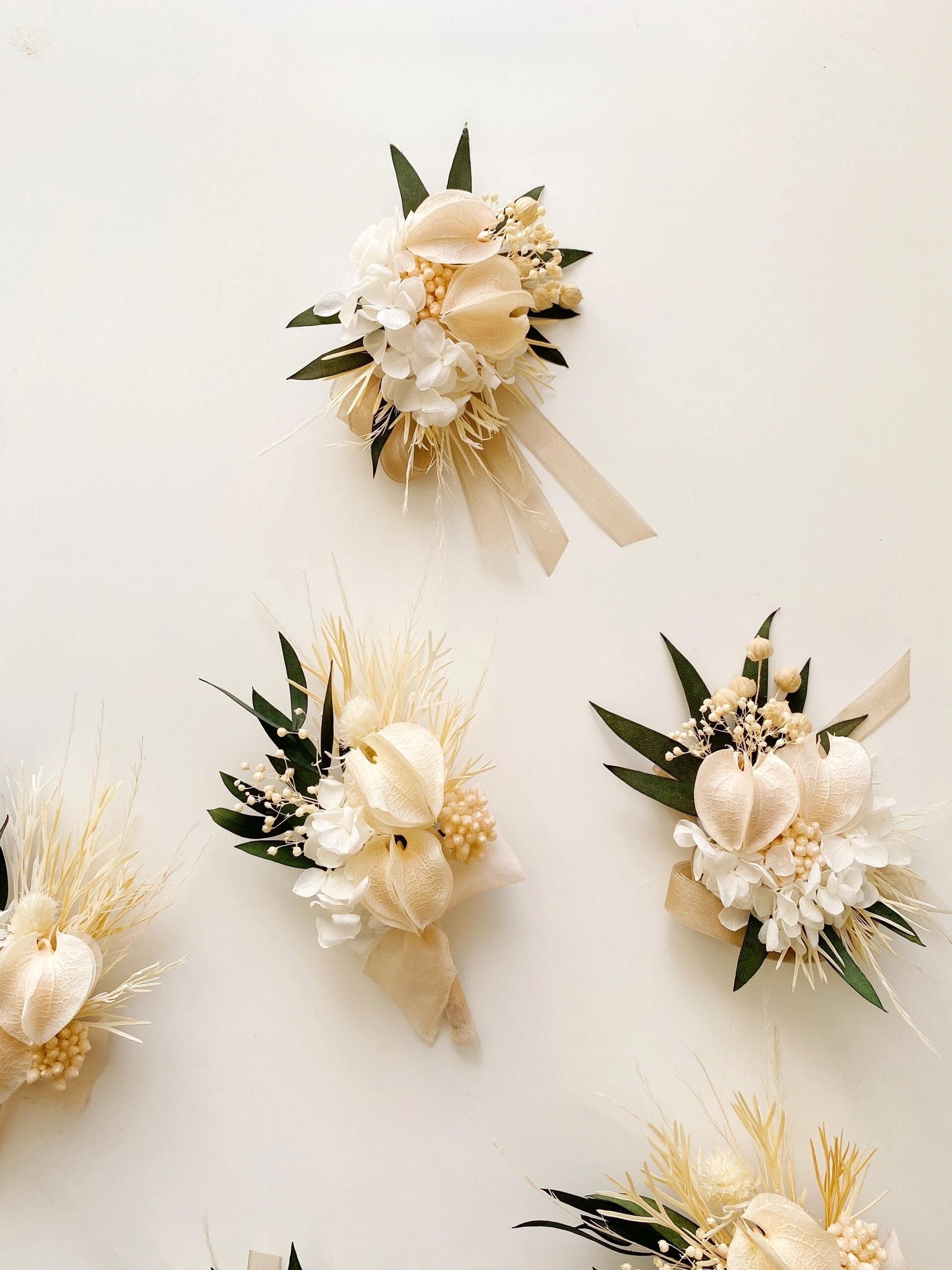 Ivory calla lily and white hydrangea boutonniere and wrist corsage set for weddings
