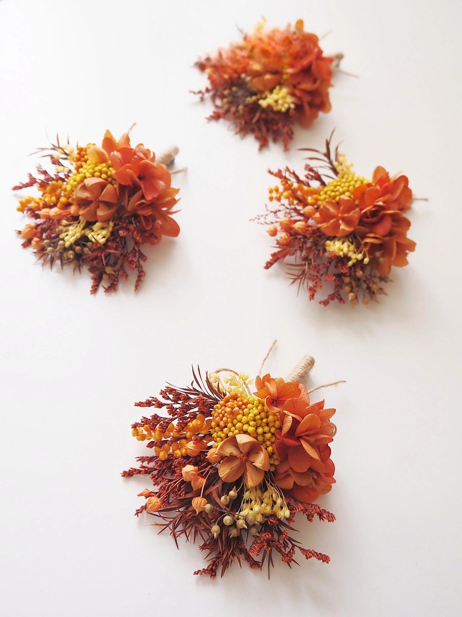 Terracotta boutonniere with autumn florals.
