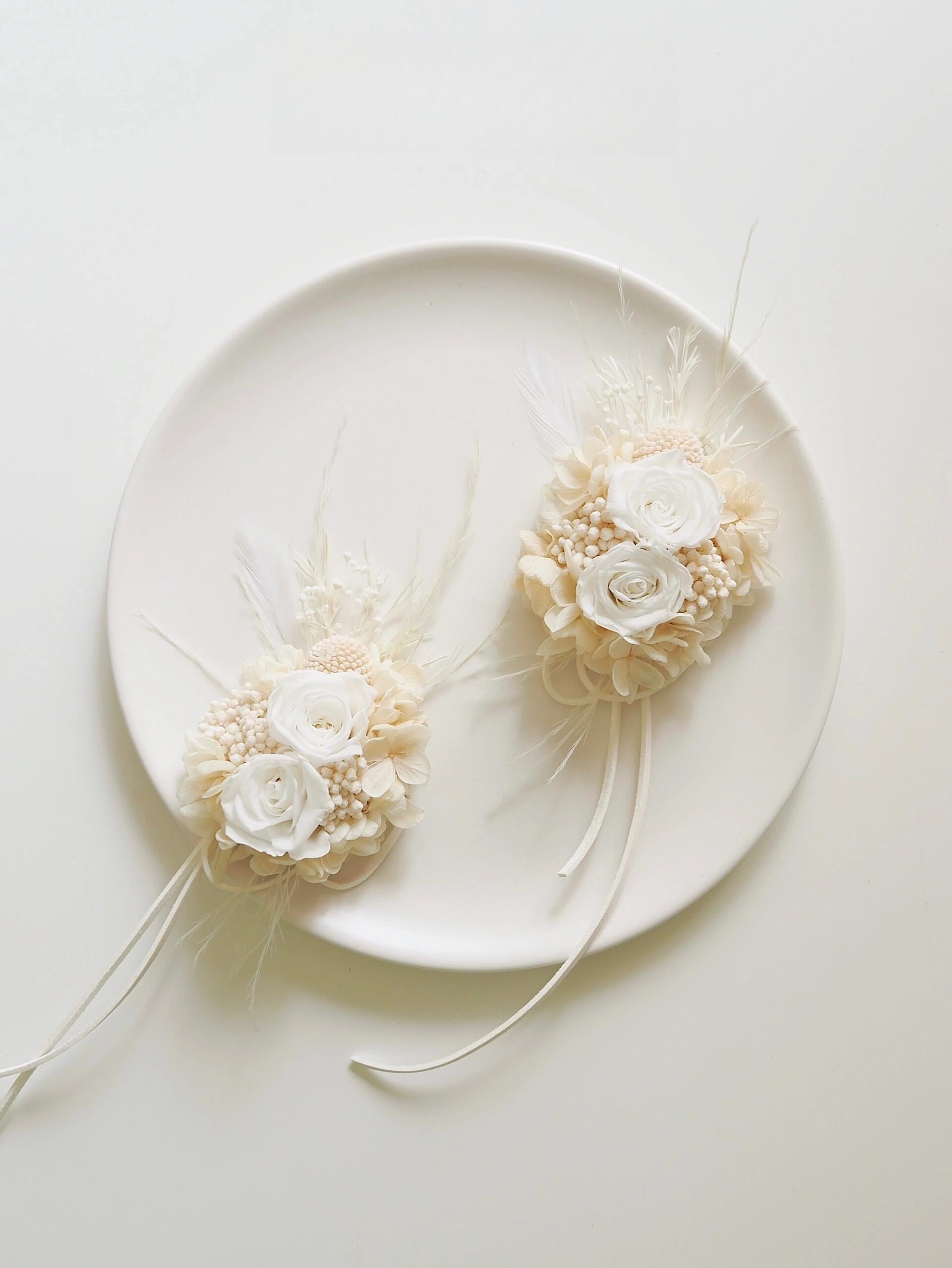 Elegant preserved ivory rose wrist corsage with hydrangea accents
