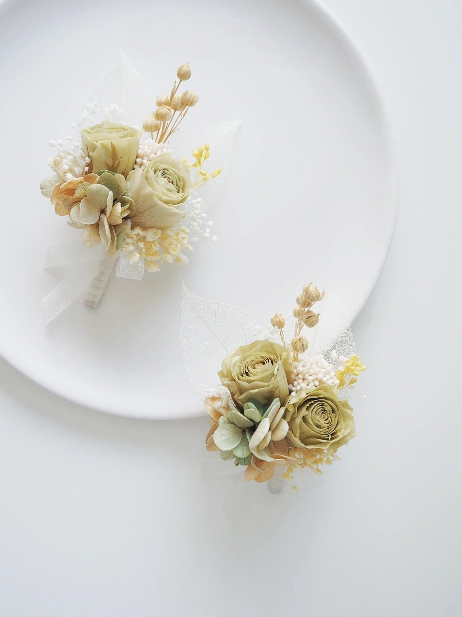 Cream rose and hydrangea preserved flower boutonniere for weddings
