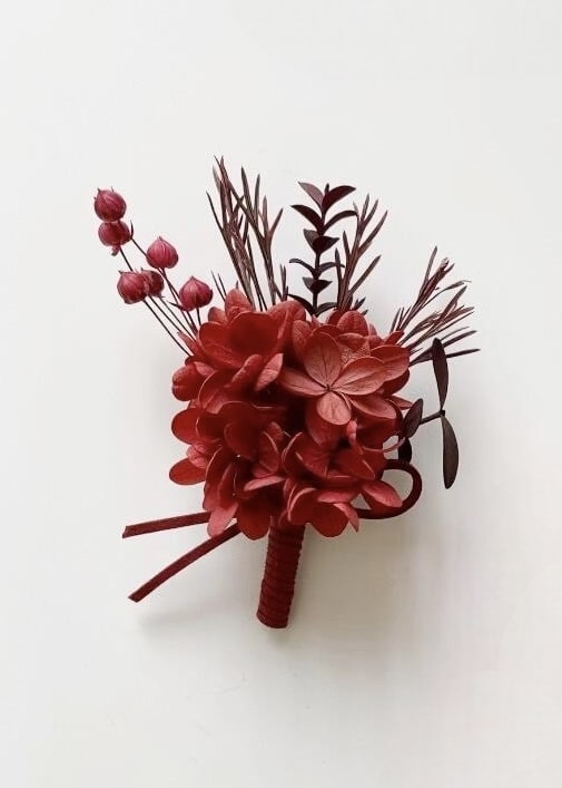 Elegant preserved terracotta and burgundy hydrangea wedding boutonniere set
