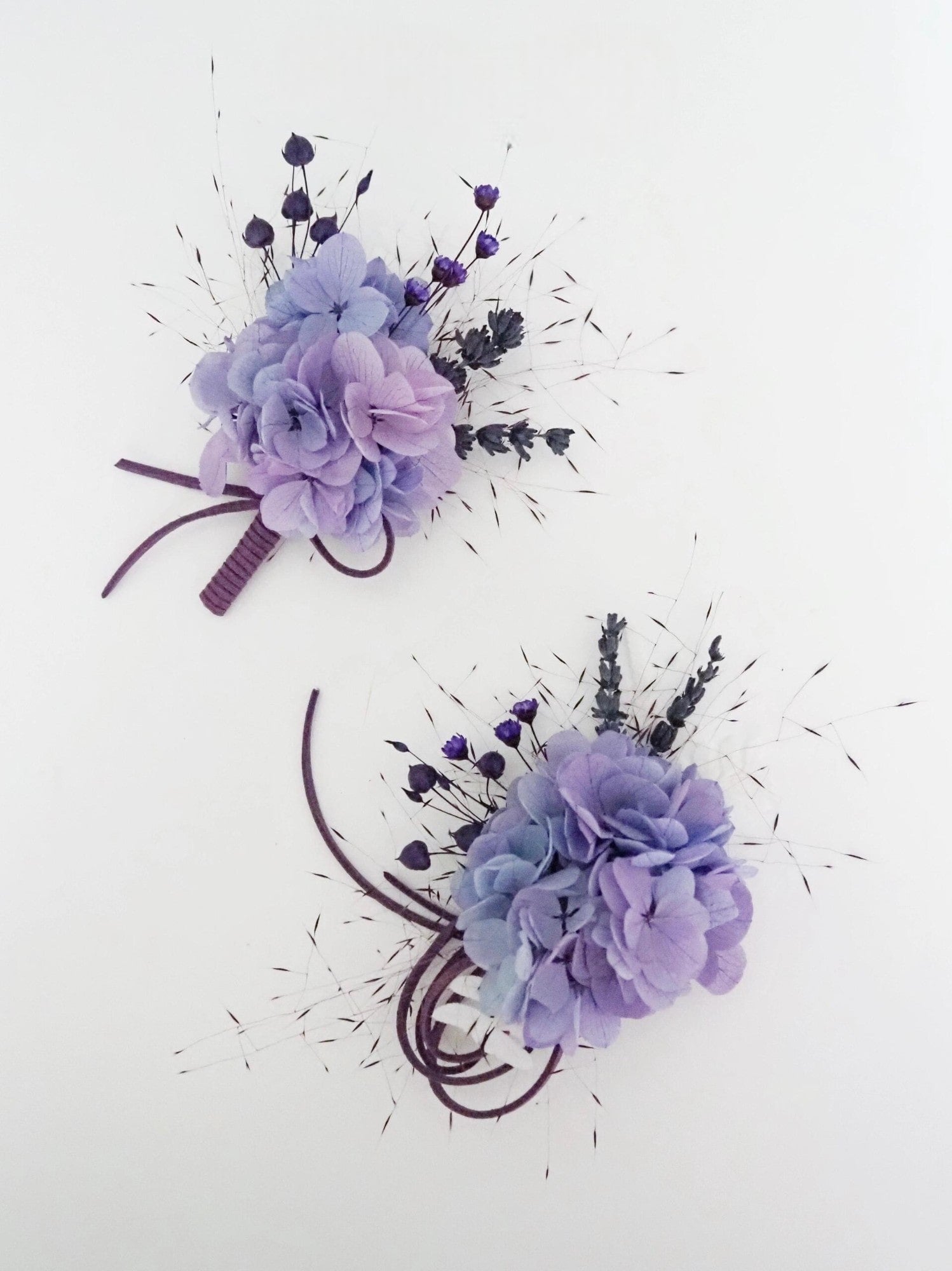 Elegant lavender hydrangea corsage with delicate details.
