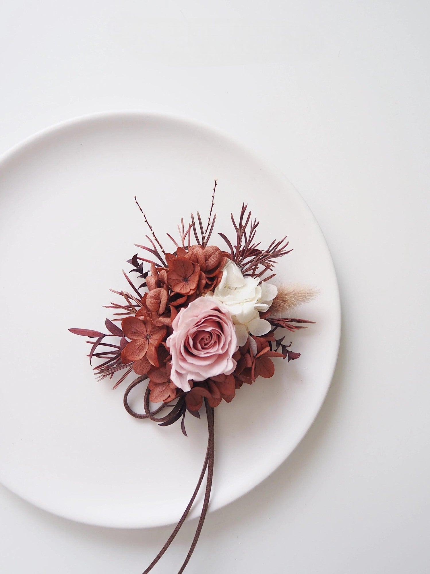 Preserved flower boutonniere and corsage set featuring blush roses and hydrangeas
