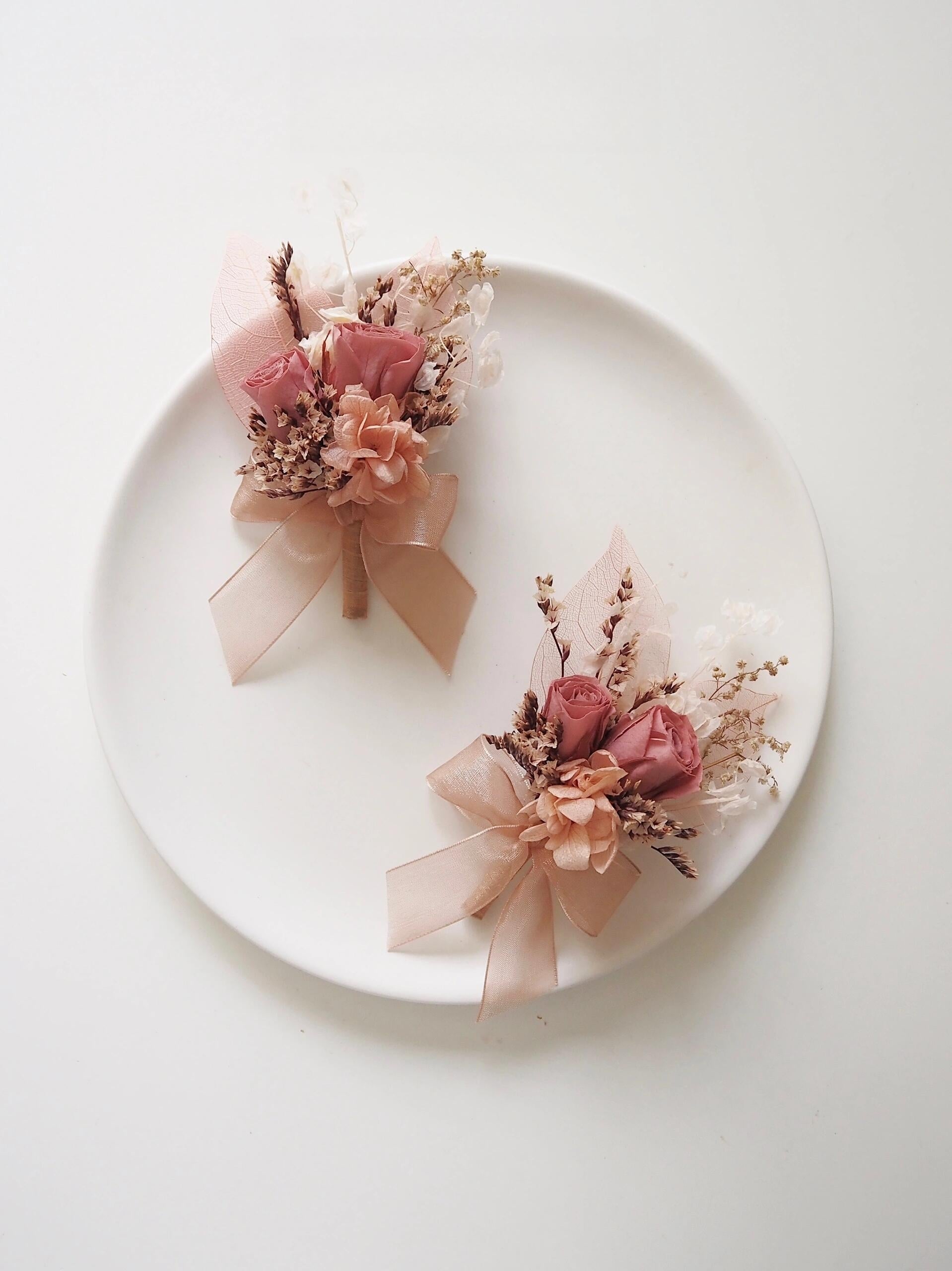 Dusty rose and peach preserved flower boutonniere for weddings
