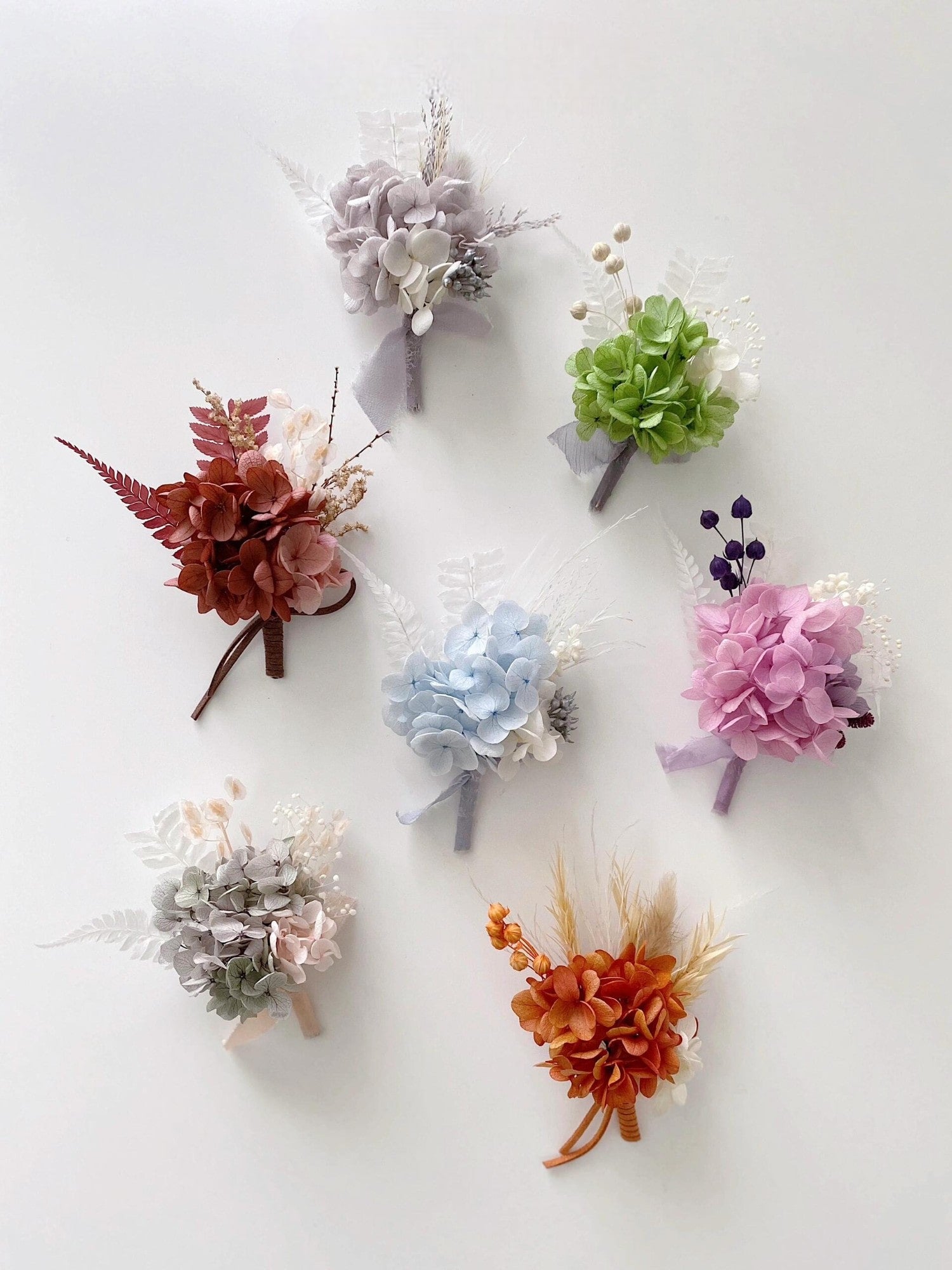 Colorful preserved flower boutonniere collection for weddings
