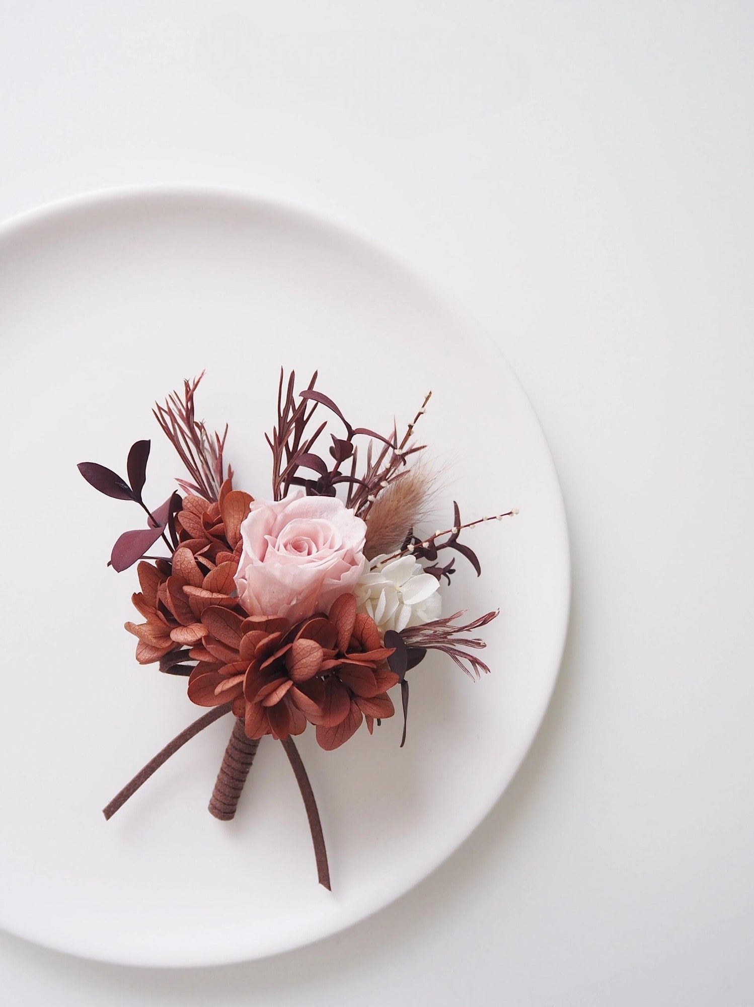 Romantic blush rose and rust hydrangea boutonniere and corsage set for weddings
