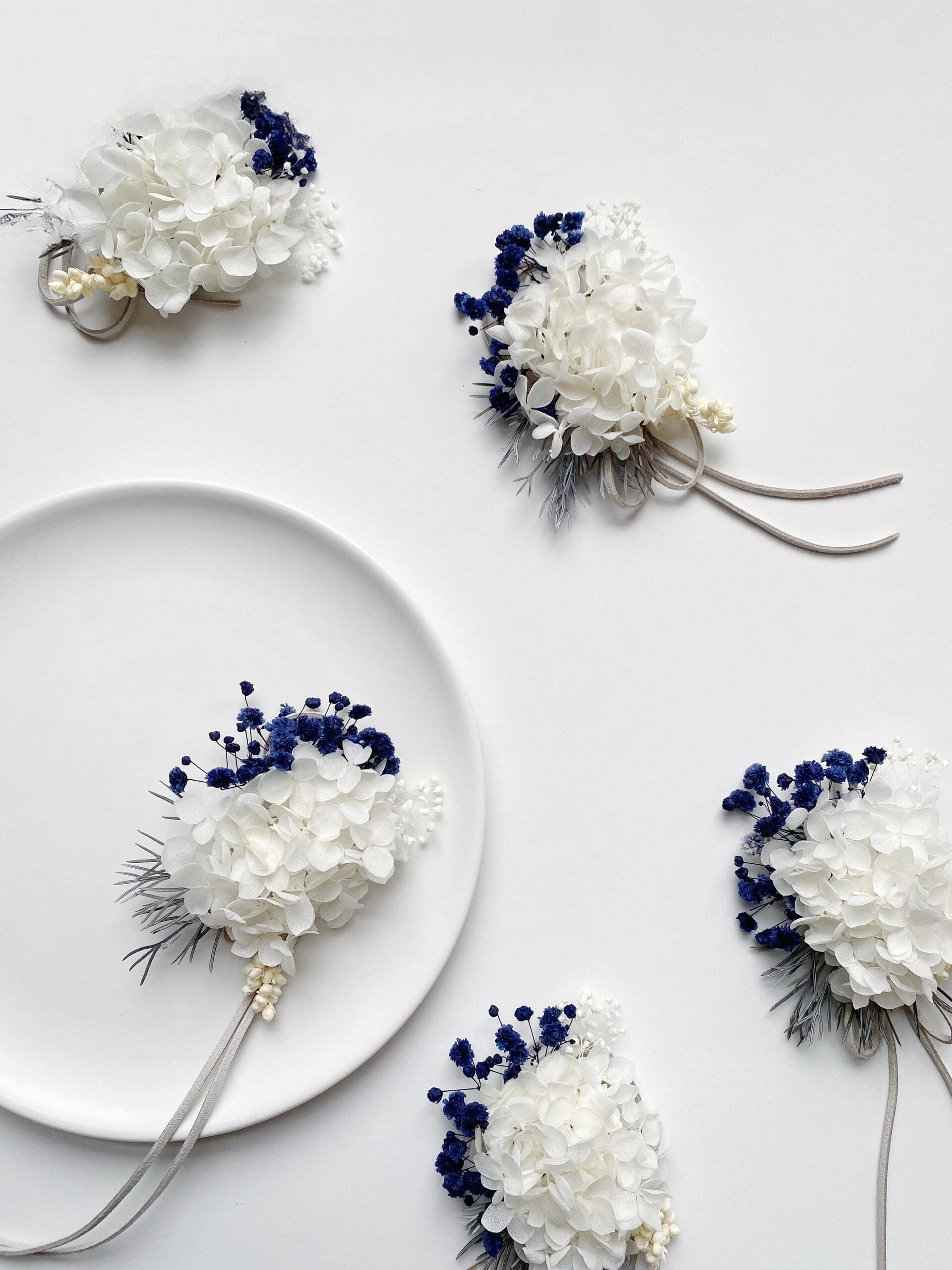 Wedding accessory with preserved hydrangeas and blue statice flowers
