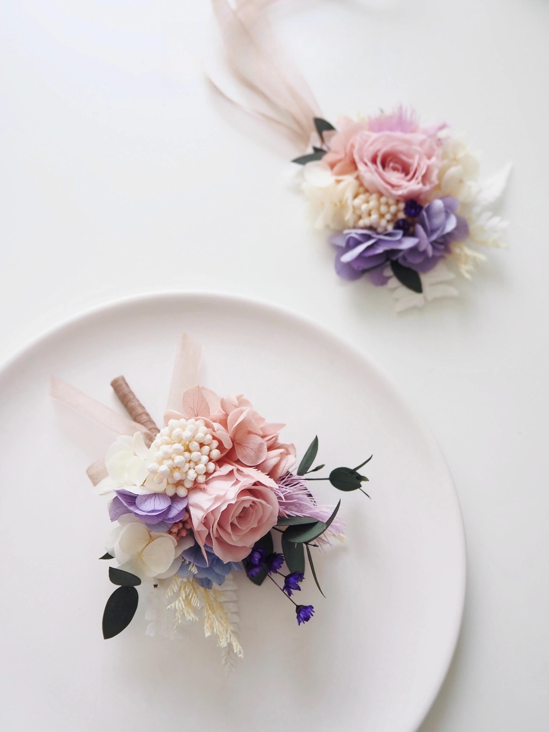 Blush rose and lilac hydrangea boutonniere and corsage set for grooms and bridesmaids
